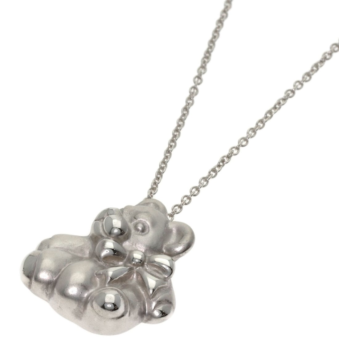 Tiffany&Co. Teddy Bear Necklace Silver: Tiffany&Co. Teddy Bear Necklace Silver This Tiffany&Co. Teddy Bear Necklace is a striking silver piece, featuring a teddy bear design. The necklace measures 16.5 inches in length and is made of