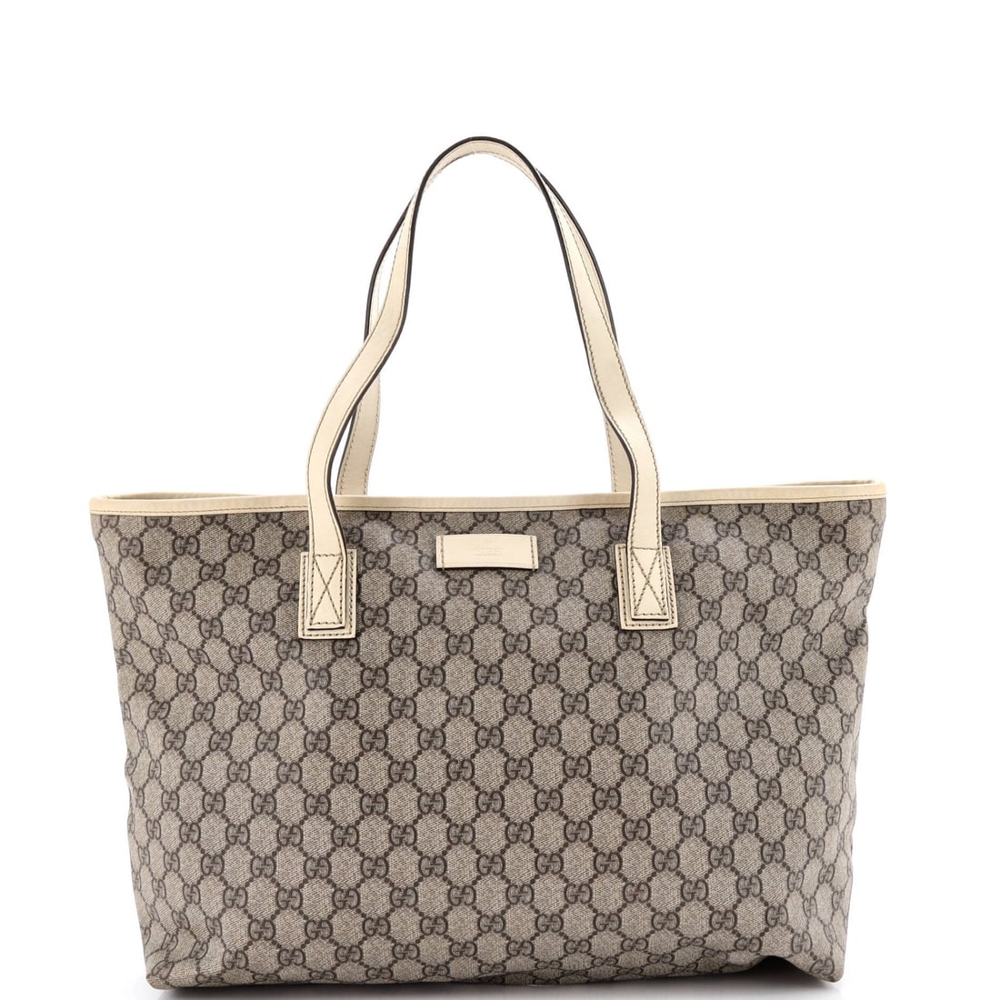 Gucci Coated Canvas Tote GG Medium Leather: Gucci Coated Canvas Tote GG Medium Leather The Gucci Coated Canvas Tote GG Medium Leather features a unique canvas-coated exterior in brown, complemented by leather accents and aged silver hardware. W