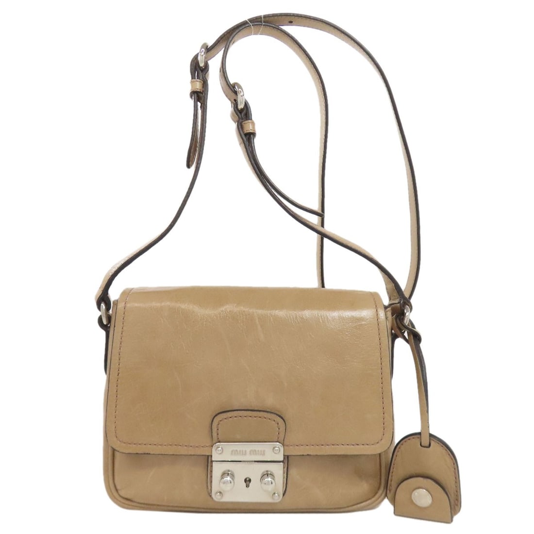 Logo Leather Shoulder Bag: Logo Leather Shoulder Bag Beige leather shoulder bag with a classic design, featuring a signature on the exterior. Made from high-quality leather, this bag has a timeless look and feel. The simple,