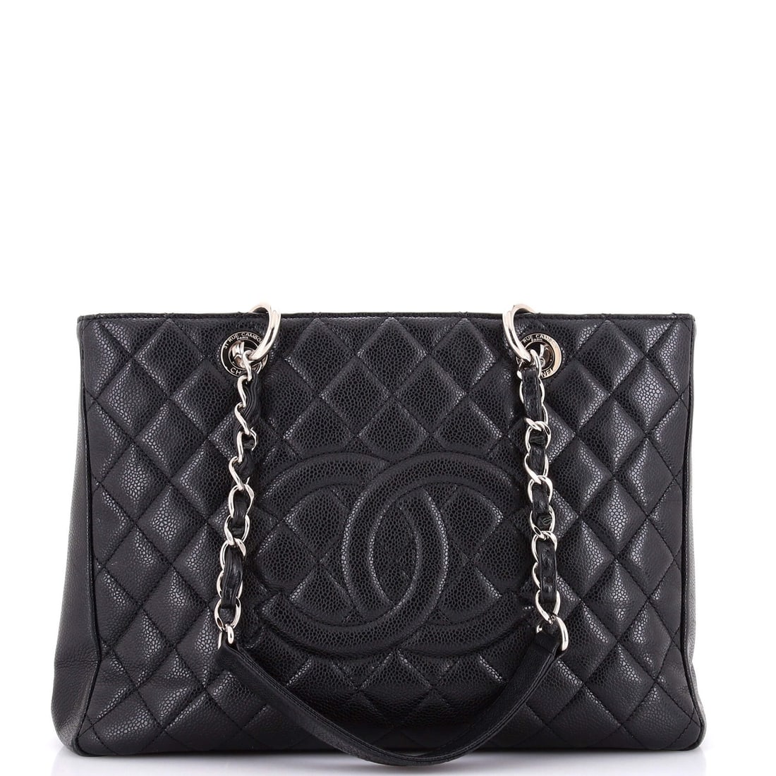 Caviar Quilted Shopping Tote Chanel: Caviar Quilted Shopping Tote Chanel Black quilted caviar leather Chanel shopping tote with satin interior, featuring silver hardware and a classic design. Measuring 9.5" tall, 13" wide, and 5" deep,