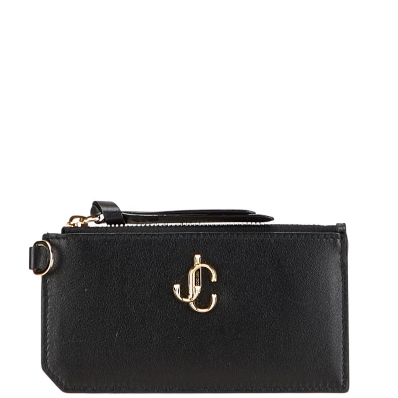Jimmy Choo Coin Purse/ Coin Case Leather: Jimmy Choo Coin Purse/ Coin Case Leather Black leather coin purse with a zipper closure, measuring 7.5cm x 14cm x 5.00mm, designed by Jimmy Choo. This compact leather case is perfect for storing