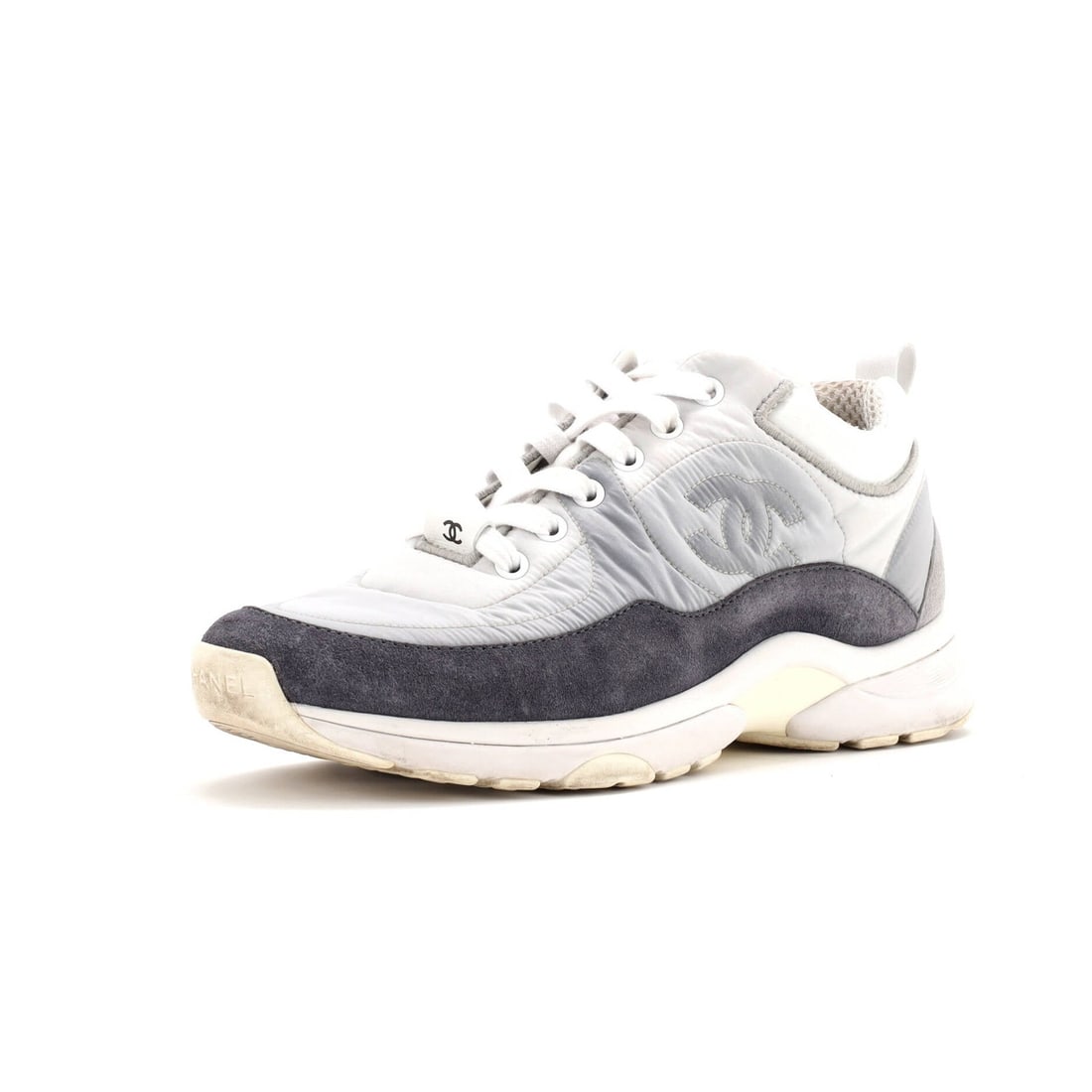 Chanel Women's Suede with Leather Low Top Sneakers: Chanel Women's Suede with Leather Low Top Sneakers Gray suede and leather low-top sneakers from Chanel, featuring a classic design with a suede and leather exterior and a nylon interior. The shoes