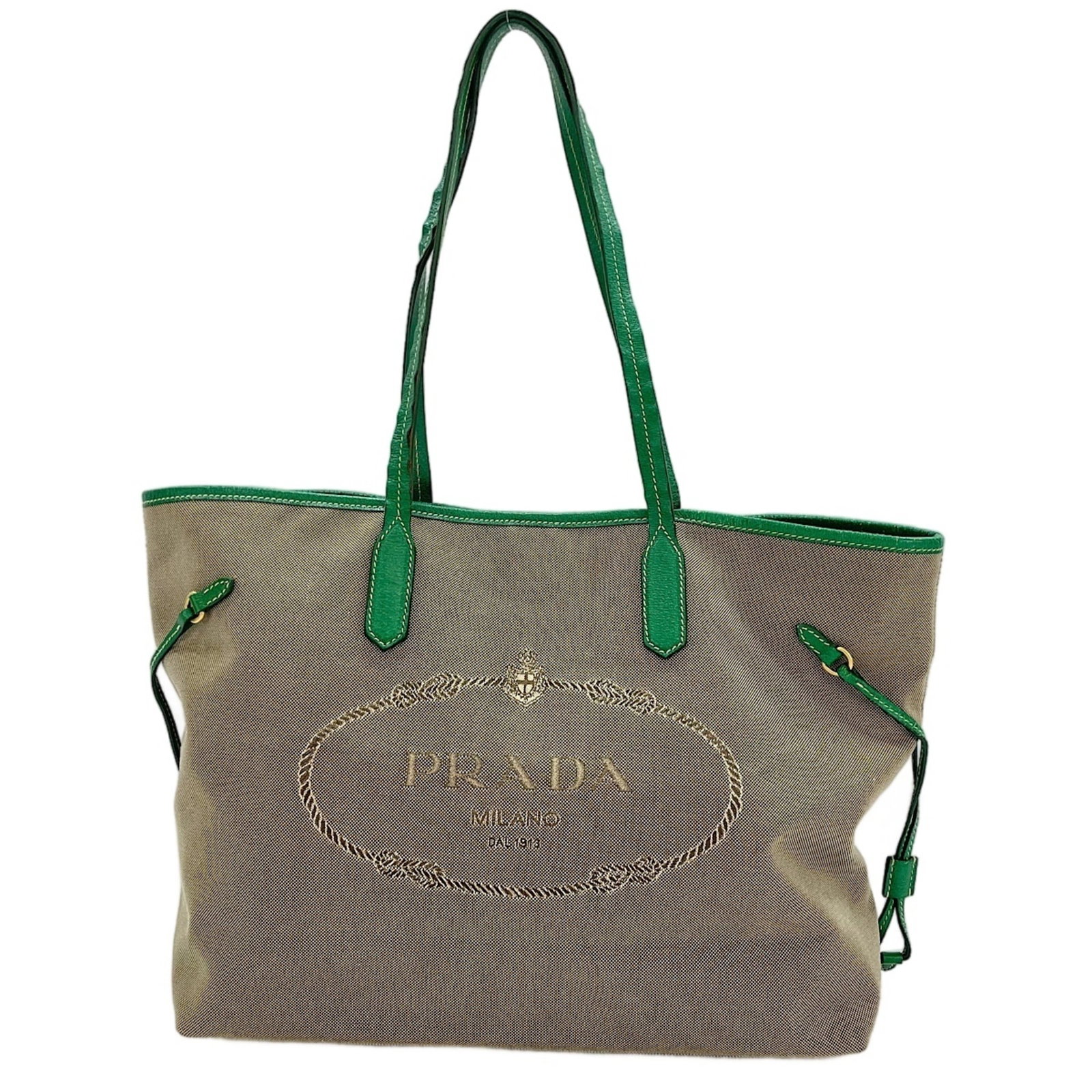 Tote Bag Prada: Tote Bag Prada This Prada tote bag is a classic design from Italy, featuring a beige color and a size of 29cm x 44cm x 12cm. The bag's clean lines and simple style make it a timeless choice for