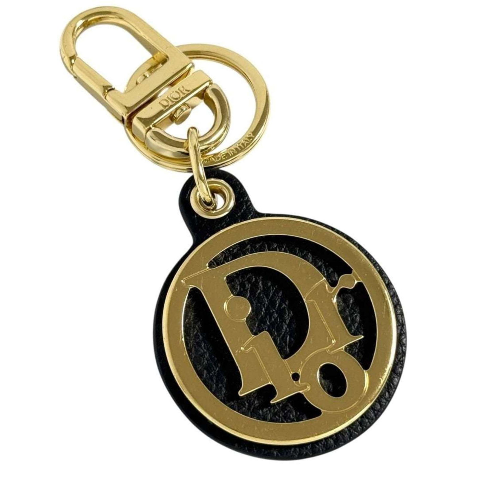 Dior Metal Leather Keyring: Dior Metal Leather Keyring The Dior Metal Leather Keyring boasts sleek, modern design with a striking combination of black leather and gold accents. Made from high-quality materials, its durable const