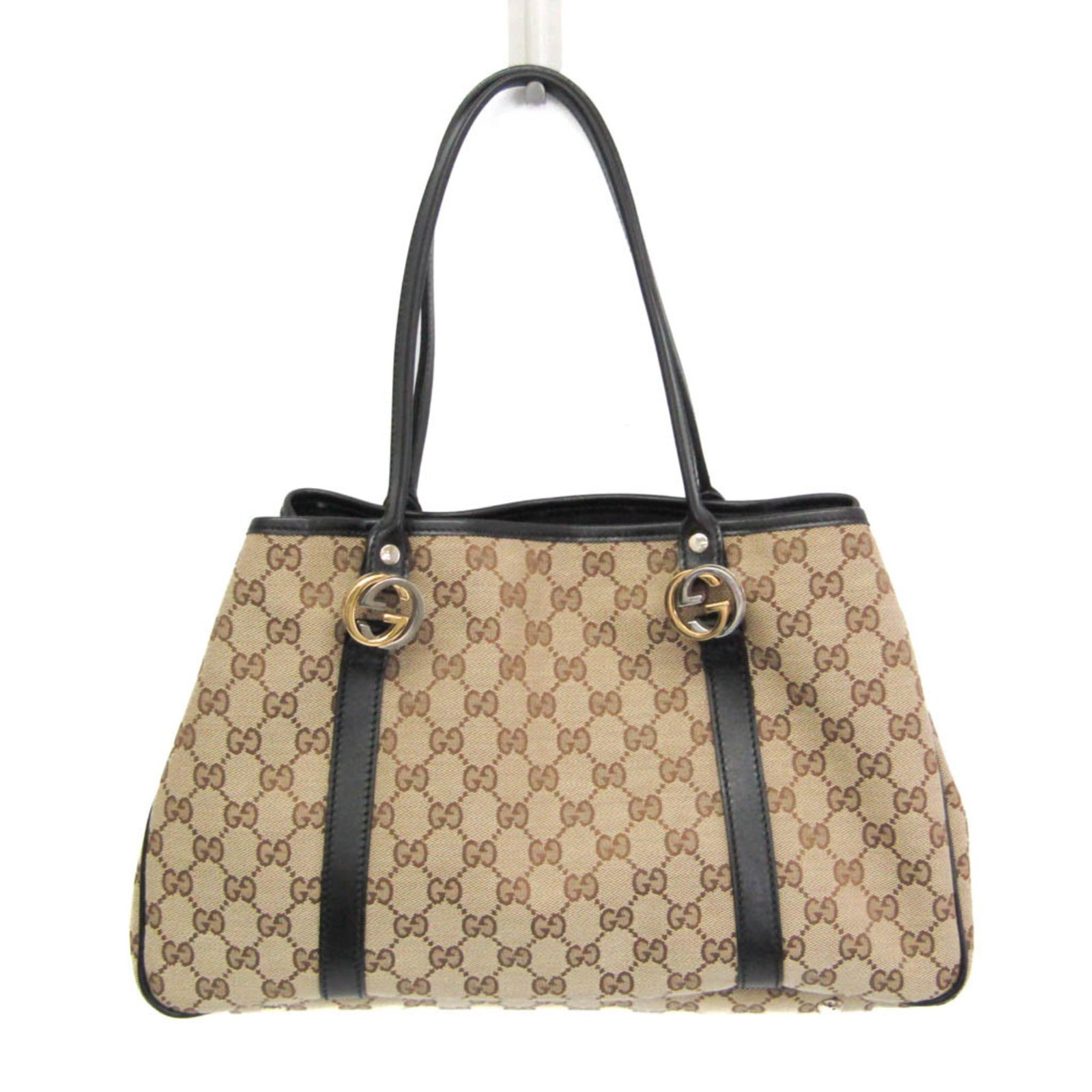 Canvas Gucci Tote Bag: Canvas Gucci Tote Bag Canvas Gucci Tote Bag with classic GG Twins design, featuring a timeless beige and black color combination and gold and silver hardware. This stylish tote boasts a spacious
