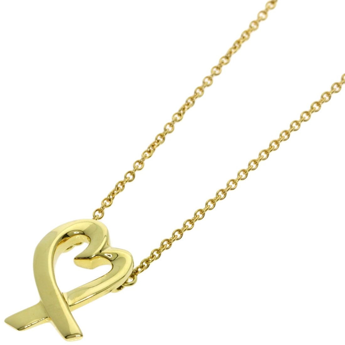 Loving Heart Necklace Tiffany&Co. K18 Yellow Gold: Loving Heart Necklace Tiffany&Co. K18 Yellow Gold K18 Yellow Gold necklace from Tiffany&Co. showcases a sleek, gold design with an open closure. This 16.1-inch long necklace is crafted from