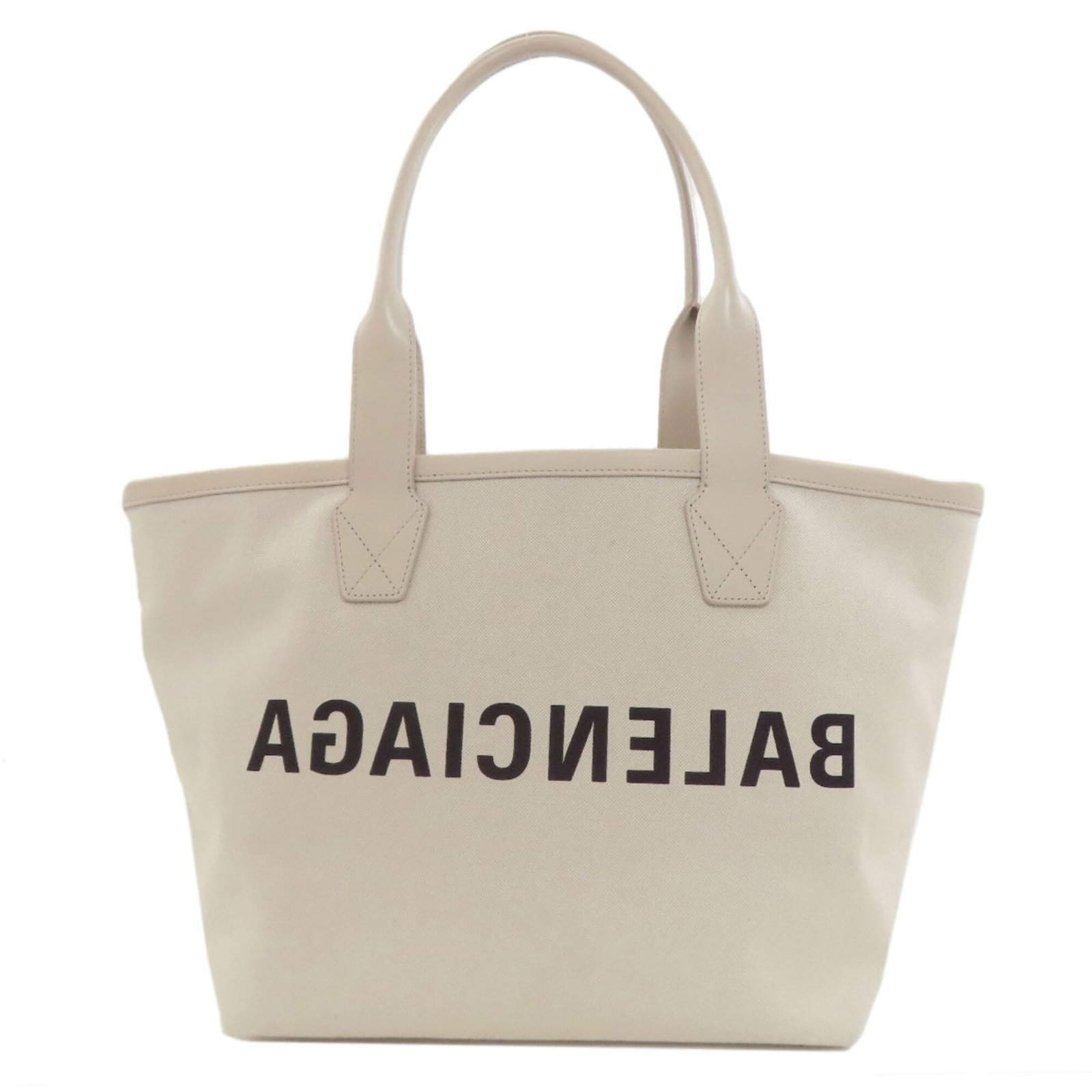 Canvas tote Bag Balenciaga: Canvas tote Bag Balenciaga Canvas tote bag from Balenciaga, featuring a white canvas material and a size of 26cm x 46cm x 17.5cm. This bag is made from canvas and has no additional accessories. The