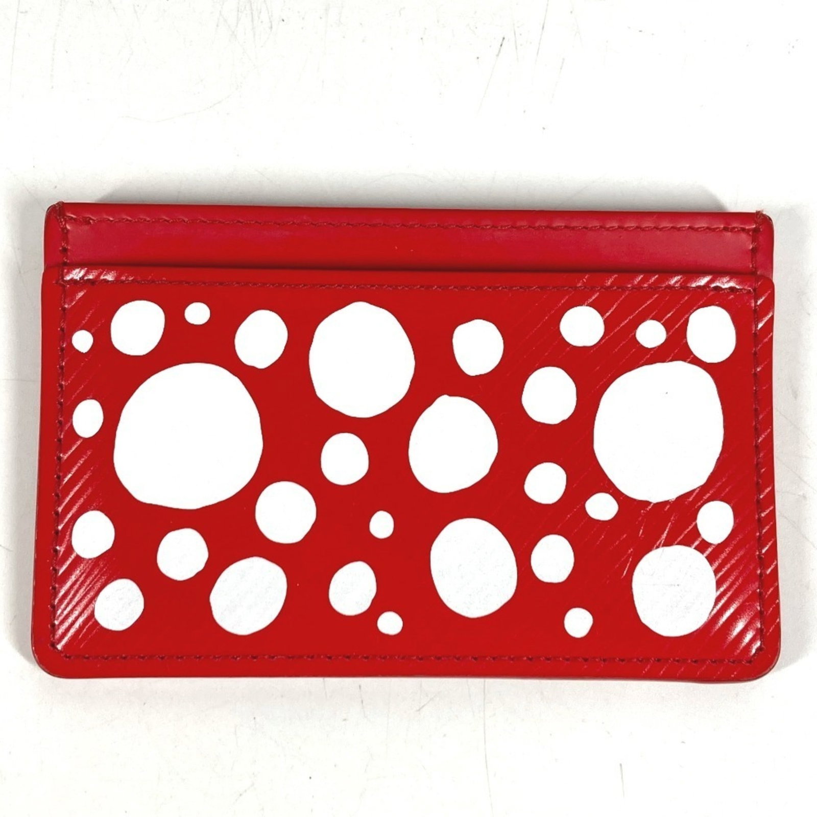 Epi Leather Card Case Louis Vuitton: Epi Leather Card Case Louis Vuitton Red Epi leather card case from Louis Vuitton, measuring 7cm x 11cm, features a striking red color and premium material. This stylish accessory showcases the iconic 