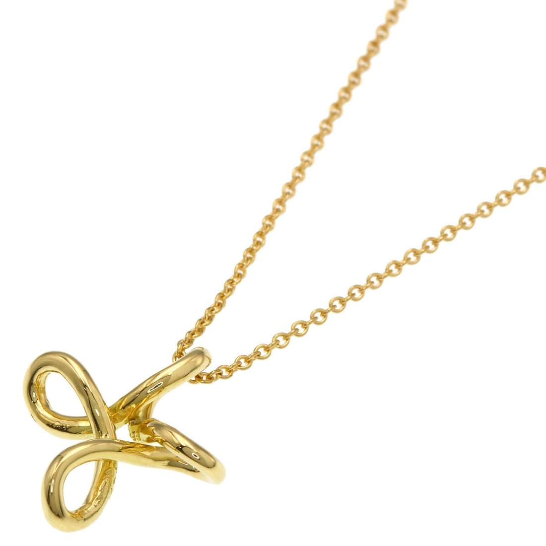 Tiffany Co Infinity Cross Necklace K18 Yellow Gold: Tiffany Co Infinity Cross Necklace K18 Yellow Gold K18 Yellow Gold Tiffany Co Infinity Cross Necklace boasts a sleek, 15.9-inch length and a luxurious gold finish. This stunning piece is crafted from 