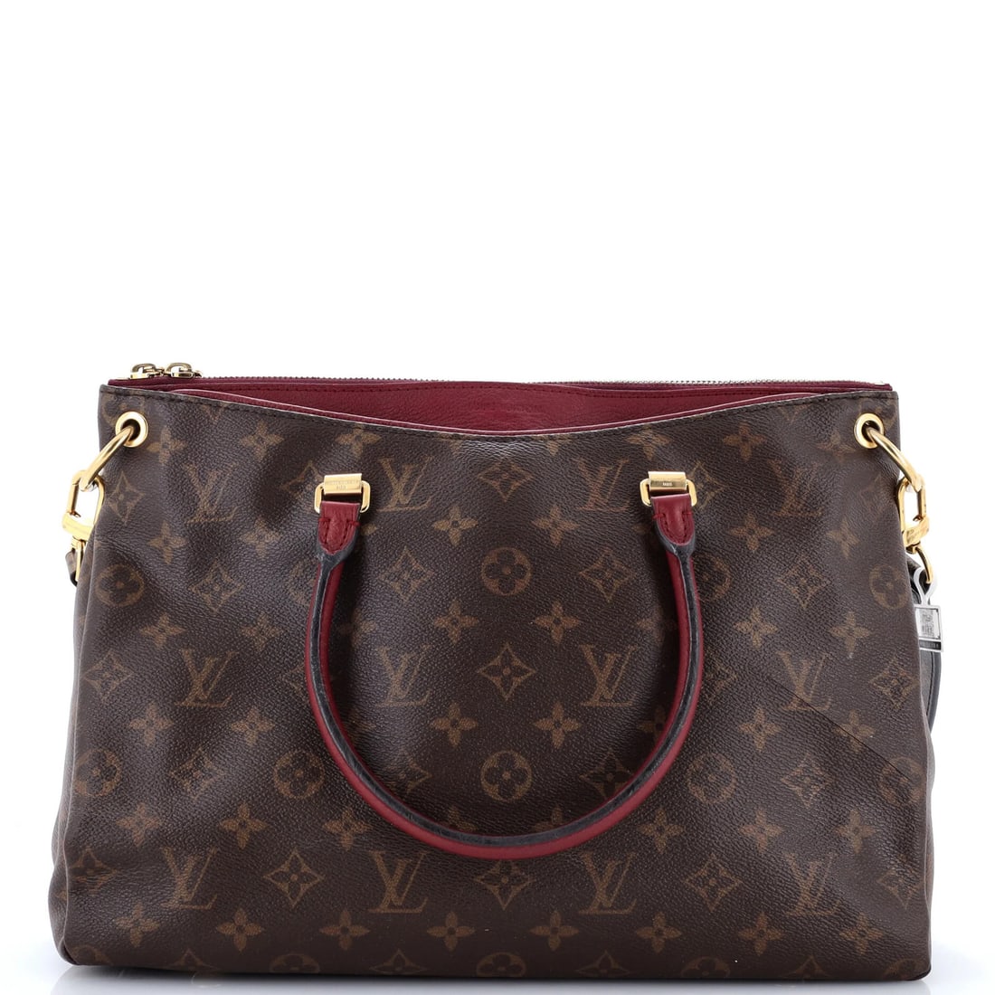 Tote Monogram Canvas with Leather Louis Vuitton: Tote Monogram Canvas with Leather Louis Vuitton Burgundy and brown hues converge in this striking Louis Vuitton tote, featuring a canvas-coated leather exterior and gold hardware. The Pallas style