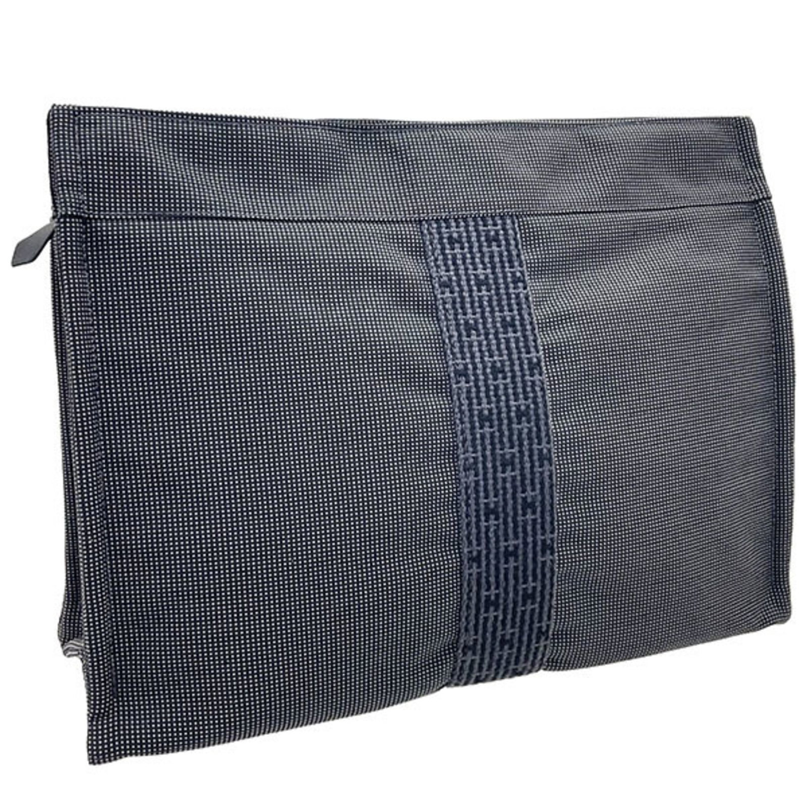 Hermes Pouch Nylon Canvas: Hermes Pouch Nylon Canvas The Hermes Pouch Nylon Canvas is a sleek and versatile accessory, featuring a durable nylon canvas material and a distinctive gray color. Measuring 22.5cm x 30.5cm x 10cm, it