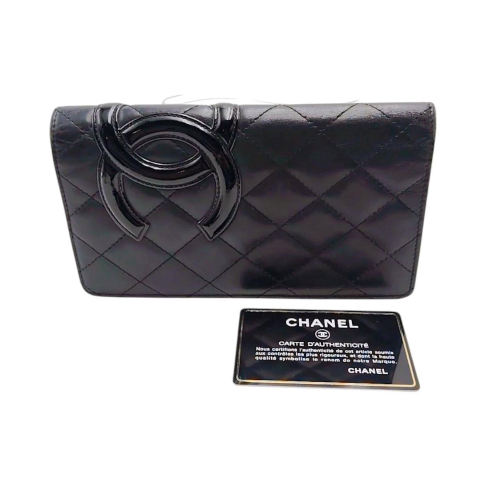 Chanel Long Wallet (Bi-Fold) Leather: Chanel Long Wallet (Bi-Fold) Leather Black or Pink Leather Chanel Long Wallet (Bi-Fold) with Guarantee Card. This Italian-made, bi-fold wallet features a sleek design and is crafted from high-quality 
