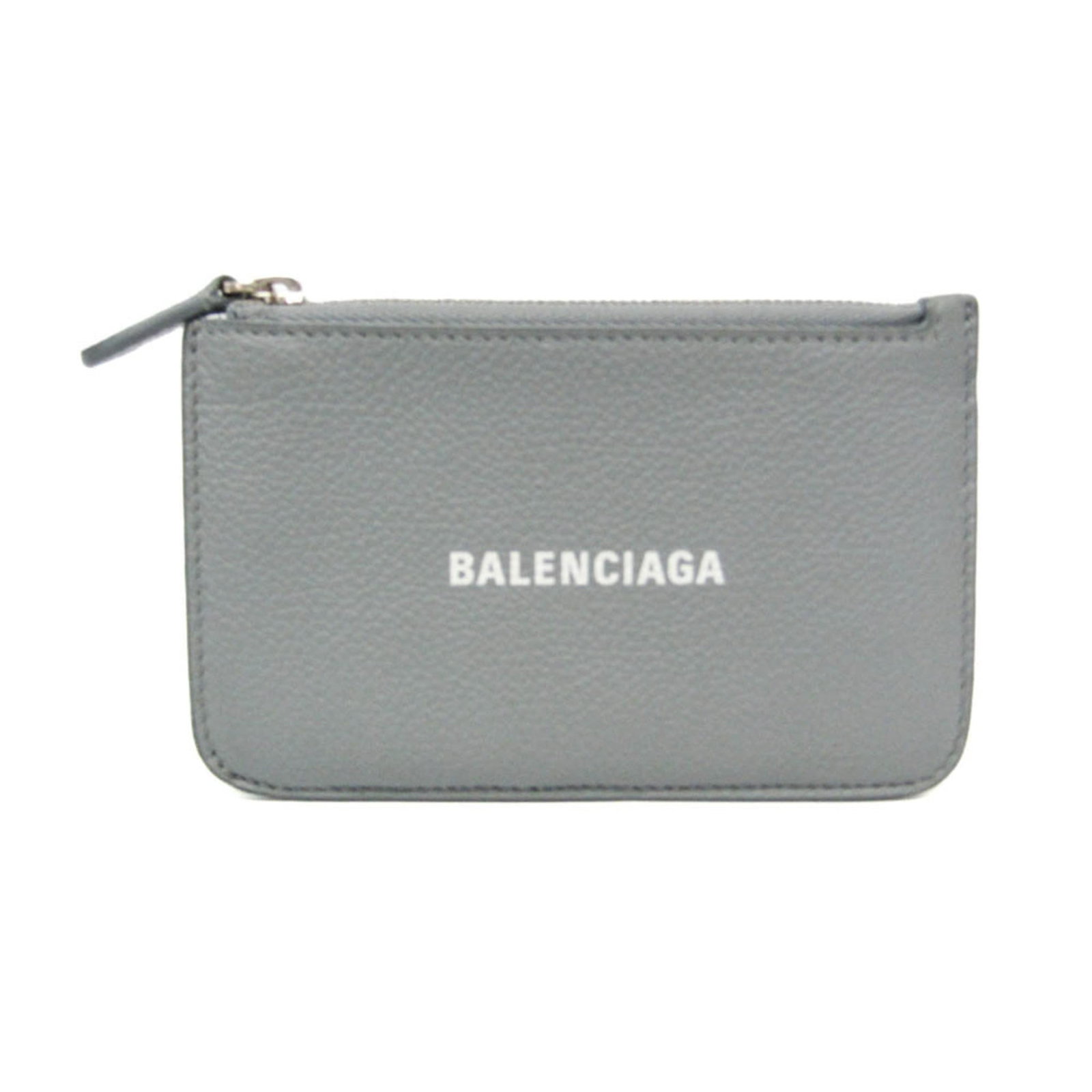 Balenciaga Coin Purse/ Coin Case Leather: Balenciaga Coin Purse/ Coin Case Leather The Balenciaga Coin Purse features a sleek gray leather design with a coin purse/coin case, card slot, and additional pocket. Made from high-quality leather, t