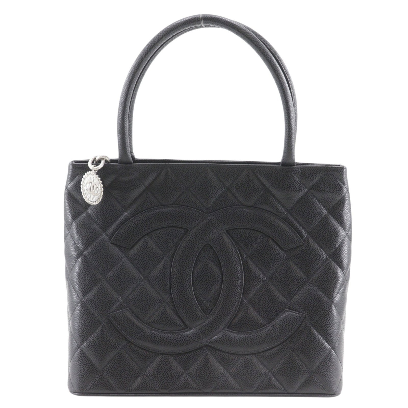 Calfskin Tote Bag Chanel: Calfskin Tote Bag Chanel Grained Calfskin Tote Bag in Black. This Chanel tote bag features a classic design with a structured shape and a timeless black color. Made from high-quality Grained