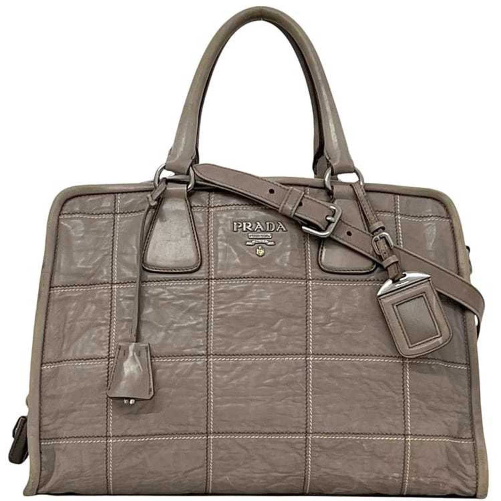 Handbag Leather Nappa Tote Shoulder Bag: Handbag Leather Nappa Tote Shoulder Bag The Prada MPN BN2217 Handbag Leather Nappa Tote Shoulder Bag features a sleek design with a gray nappa leather exterior, measuring 26cm x 37cm x 17cm. It comes
