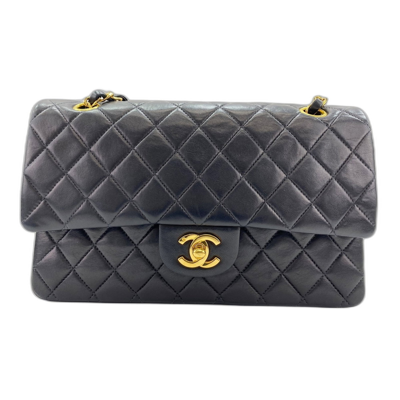 Shoulder Bag by Chanel: Shoulder Bag by Chanel Black Matelasse shoulder bag by Chanel. This classic design showcases the iconic interlocking CC clasp and features a timeless black color. A staple in any fashion enthusiast's 