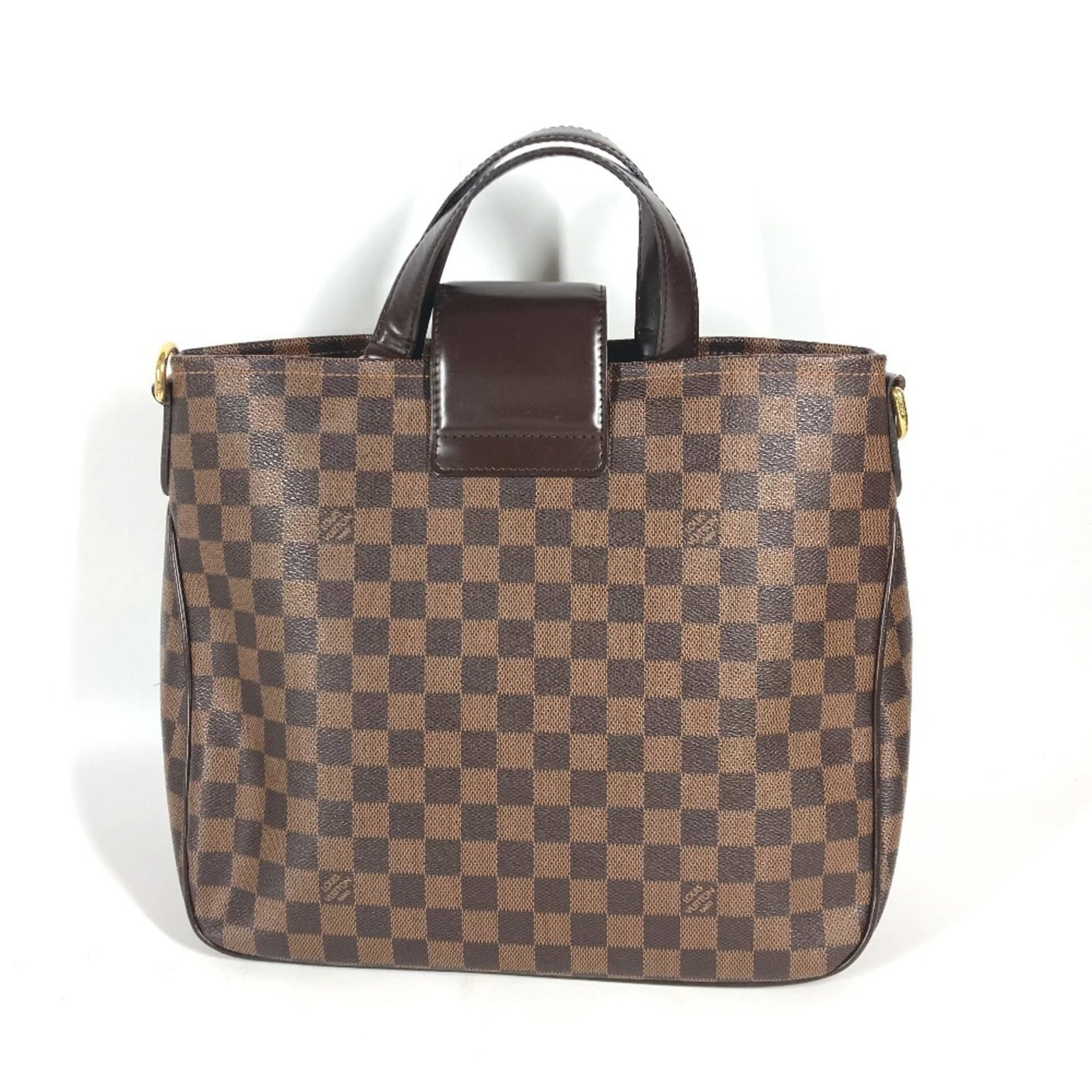 Canvas Damier Handbag Tote Louis Vuitton: Canvas Damier Handbag Tote Louis Vuitton Damier canvas adds a unique touch to this classic Louis Vuitton tote, featuring a timeless brown Ebene color. The turn lock closure provides secure and