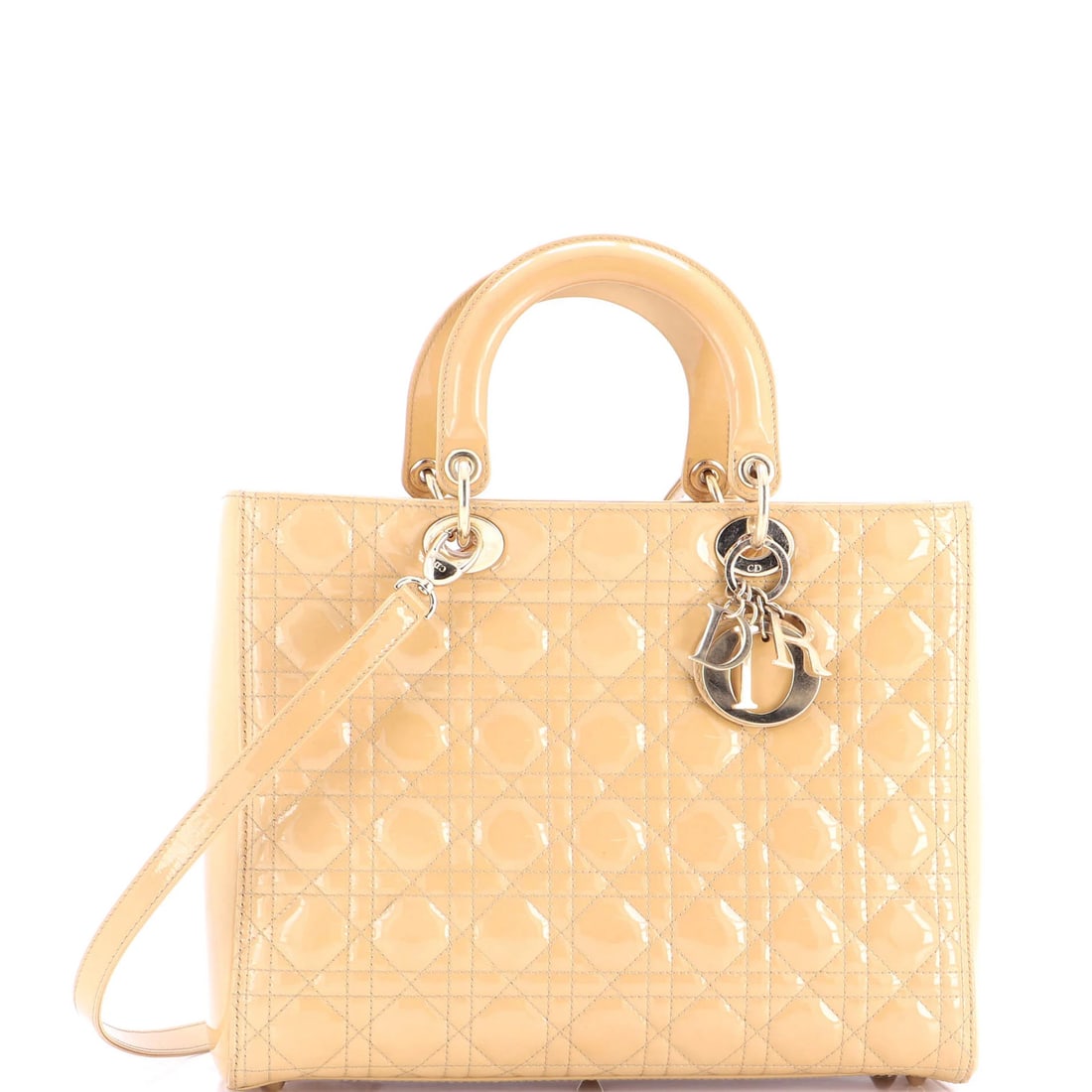 Christian Dior Lady Dior Bag Cannage Quilt Patent Large: Christian Dior Lady Dior Bag Cannage Quilt Patent Large The Christian Dior Lady Dior Bag Cannage Quilt Patent Large is a neutral-toned, patent leather top-handle bag with a quilted design. Measuring