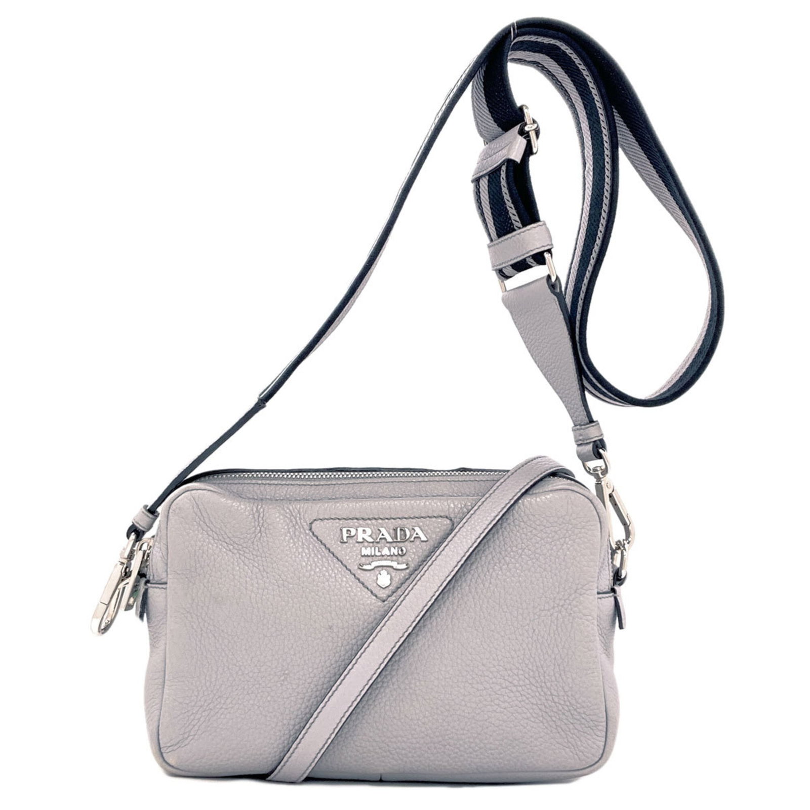 Shoulder Bag Leather Prada: Shoulder Bag Leather Prada Light gray leather shoulder bag with a zipper closure, measuring 14cm x 22.5cm x 8cm, features a calfskin material and adjustable strap length of 79cm - 123cm. The bag's