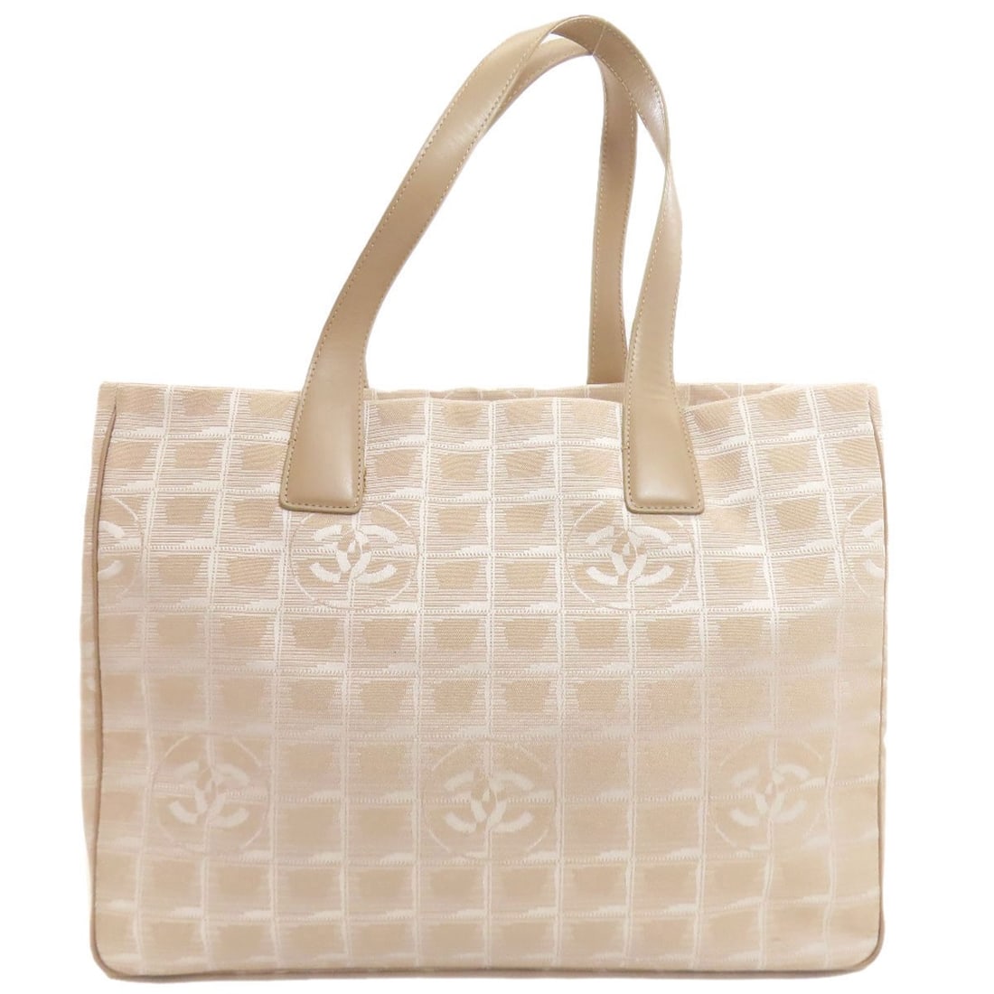 Chanel New Travel Line Mm Goldhardware Tote Bag Nylon Jacquard: Chanel New Travel Line Mm Goldhardware Tote Bag Nylon Jacquard Beige nylon jacquard tote bag with gold hardware from CHANEL's New Travel Line, featuring a classic design with a modern twist. The