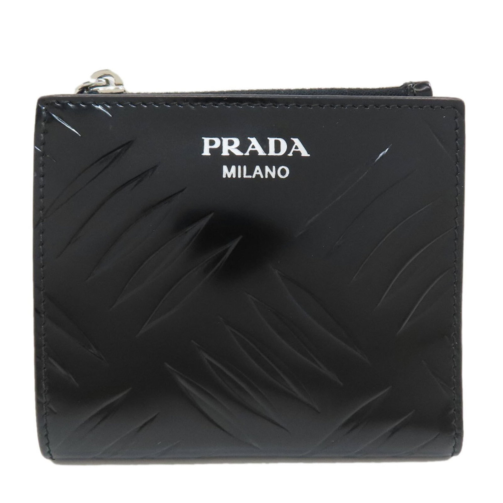 Bi fold leather wallet: Bi fold leather wallet Bi-fold leather wallet in black, measuring 9.5cm x 10cm x 1cm, featuring a classic design with a premium leather finish. The Prada brand is known for its attention to detail