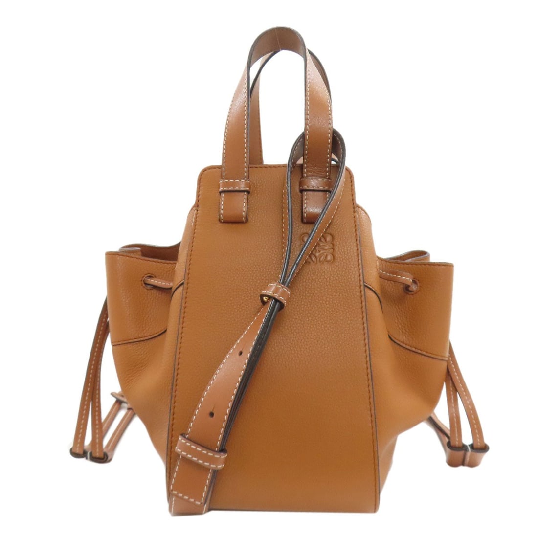Calf Handbag 2Way Hammock Loewe: Calf Handbag 2Way Hammock Loewe Calf Handbag 2Way Hammock Loewe is a brown calf handbag with a unique 2Way Hammock design. This stylish bag features a rich brown exterior made from high-quality calf
