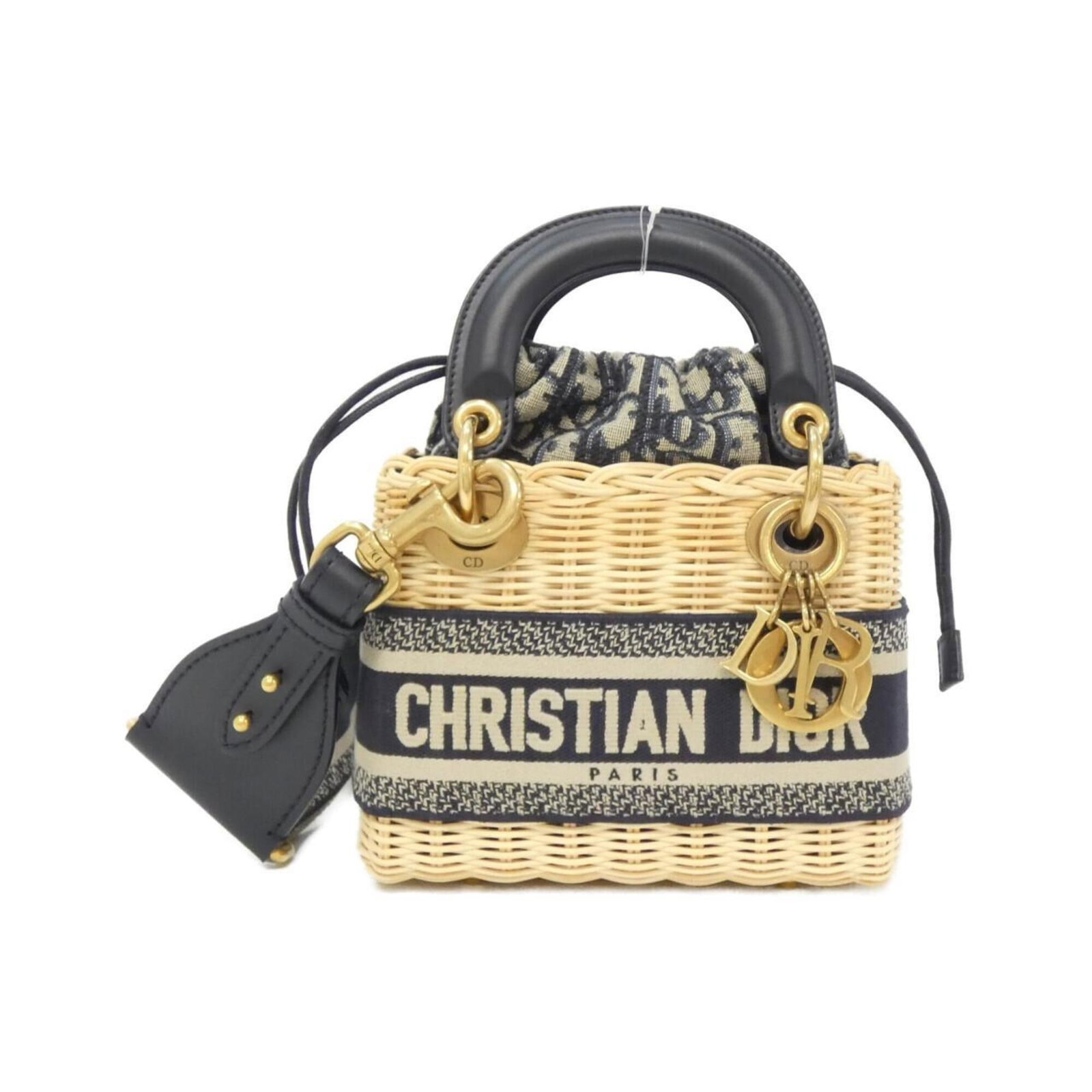 Christian Dior Handbag Canvas: Christian Dior Handbag Canvas Canvas handbag from Christian Dior's Lady Dior line, featuring a striking blue and multi-color design. Measuring 15cm x 17cm x 7cm, this compact bag weighs 860g and has a