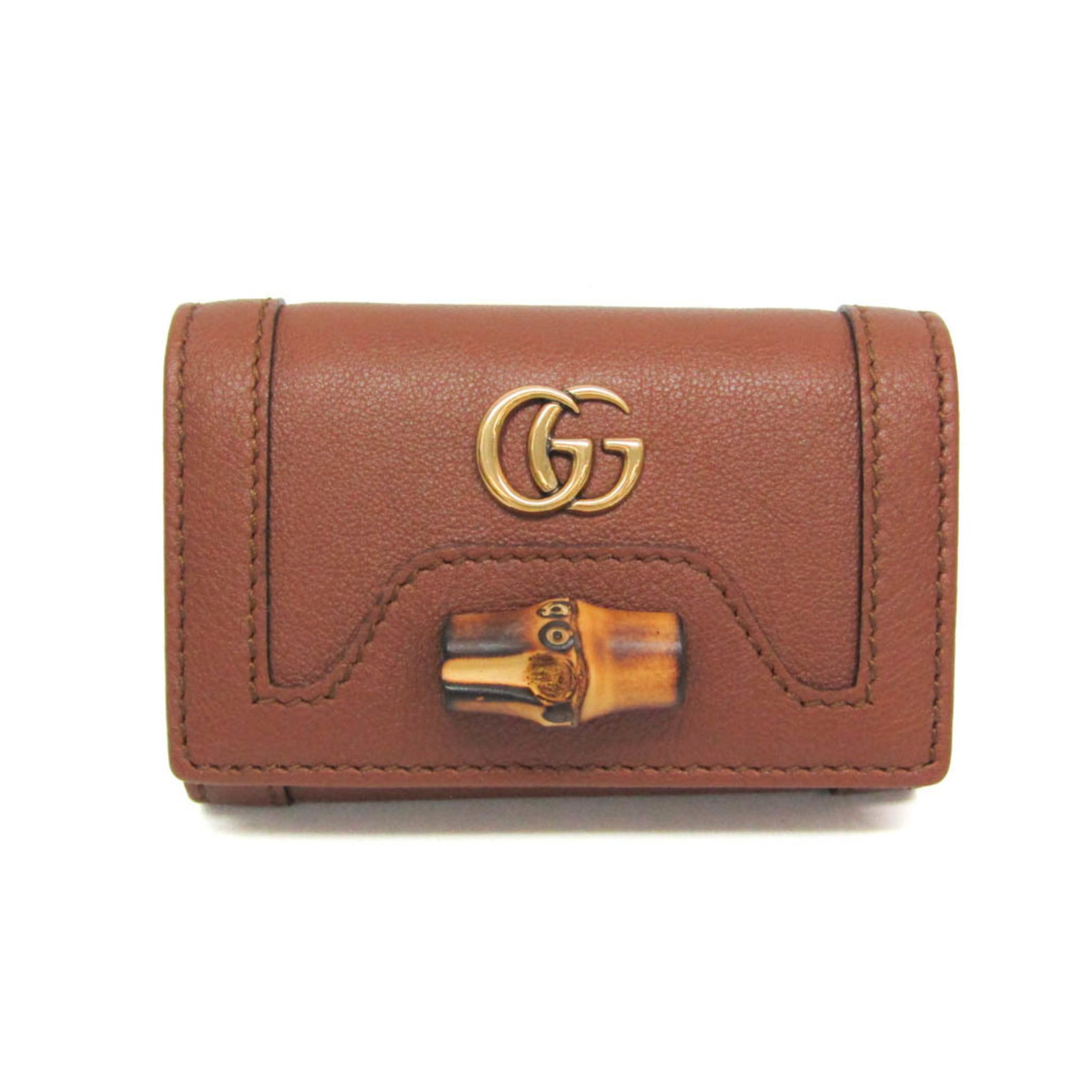 Keycase Leather Gucci: Keycase Leather Gucci Keycase Leather Gucci is a stylish accessory featuring a brown leather exterior with a snap fastener closure. The compact design holds six keys and has an open pocket for