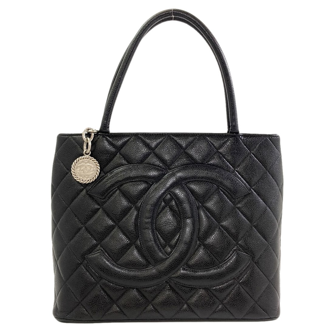 Chanel Medallion Silverhardware Tote Bag Grained Calfskin Skin: Chanel Medallion Silverhardware Tote Bag Grained Calfskin Skin Grained Calfskin Skin gives this black tote bag a luxurious feel, while the silver hardware adds a touch of sophistication. The bag's