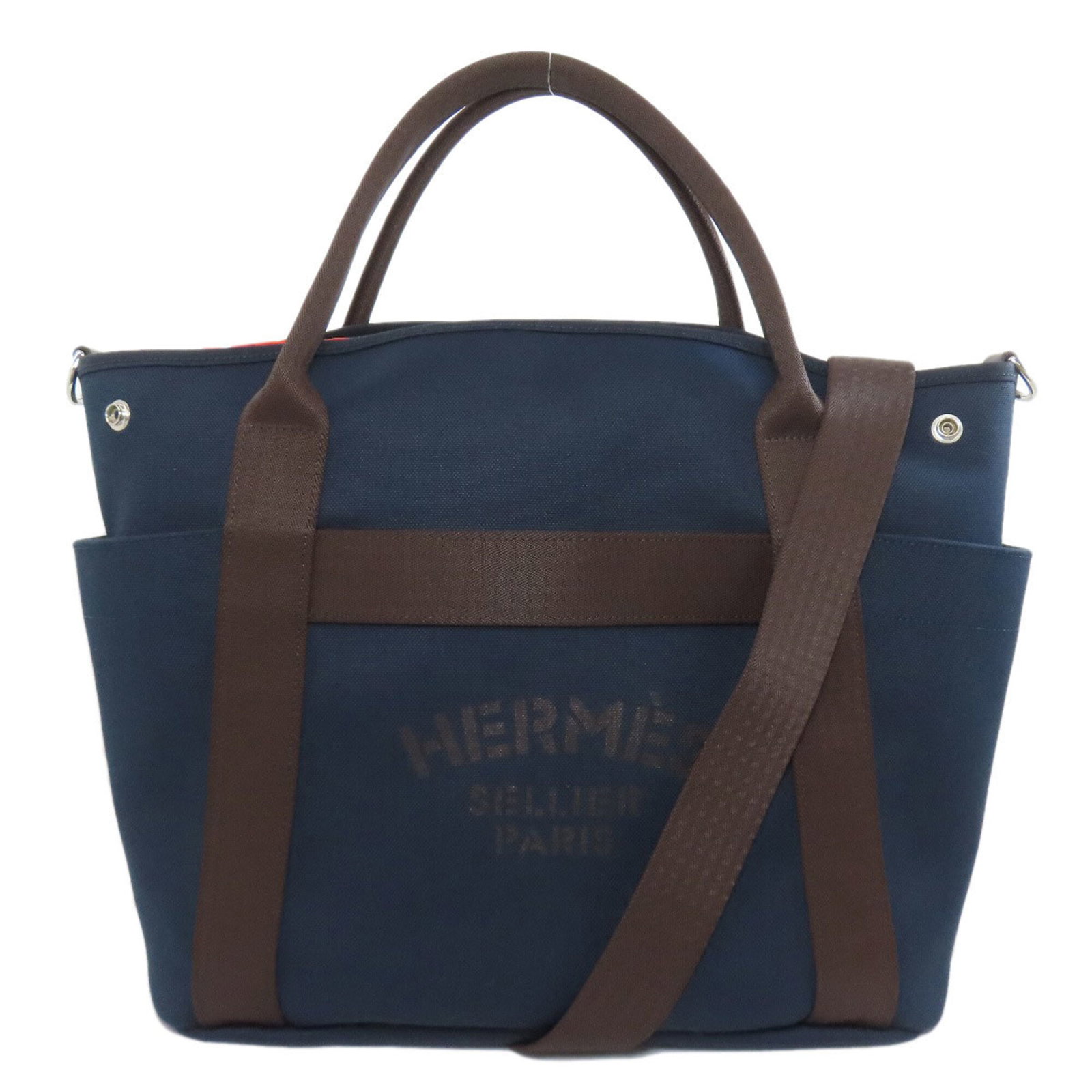 Canvas tote bag Hermes: Canvas tote bag Hermes Canvas tote bag from Hermes, featuring navy canvas material and a signature. This 34cm x 38cm x 17cm tote measures 13.38'' x 14.96'' x 6.69''. The bag's canvas material