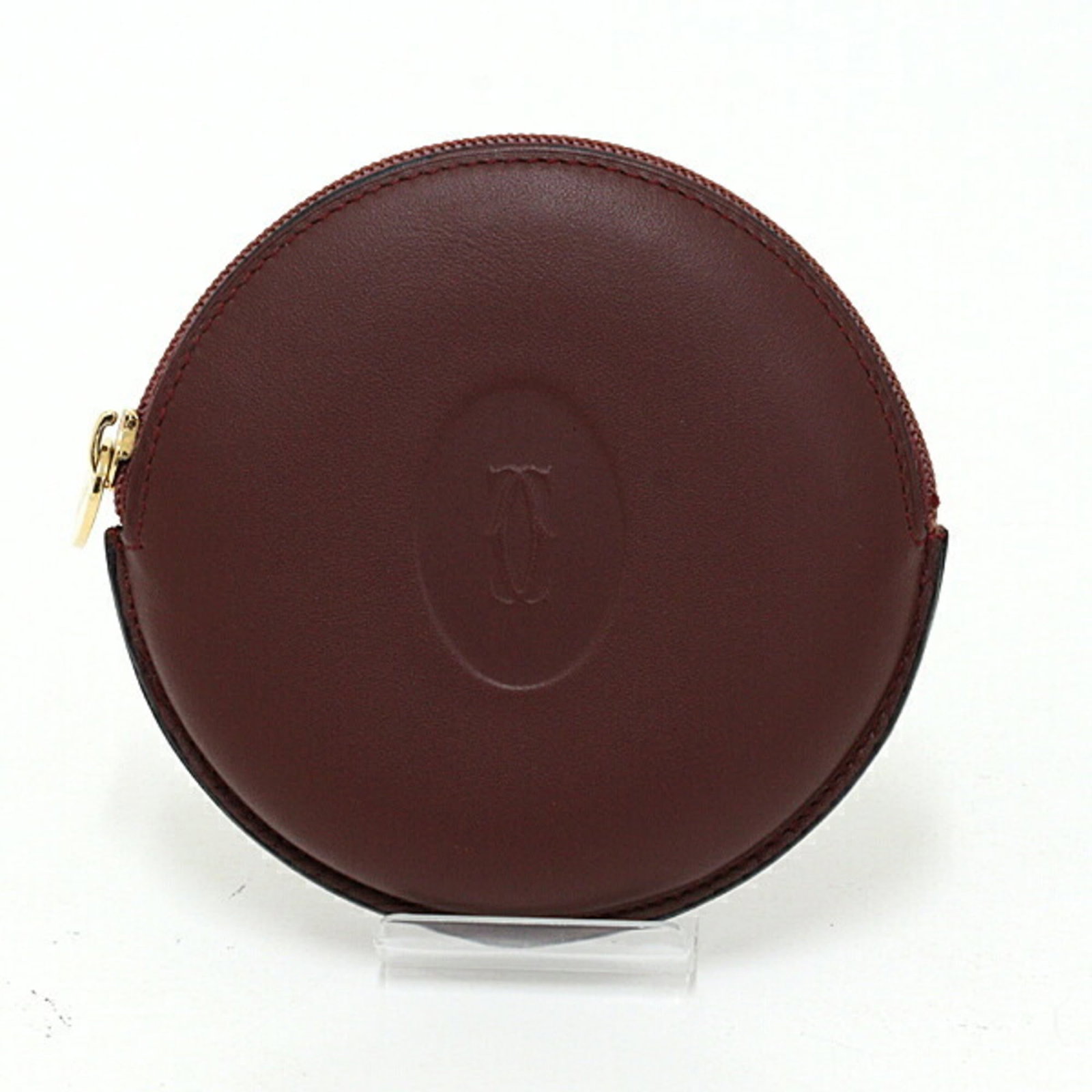 Coin Case Leather Purse Cartier: Coin Case Leather Purse Cartier Cartier's leather coin case is a sleek and sophisticated accessory, measuring 9.5cm x 10cm x 2cm. Made from high-quality leather, it features a classic Bordeaux color.