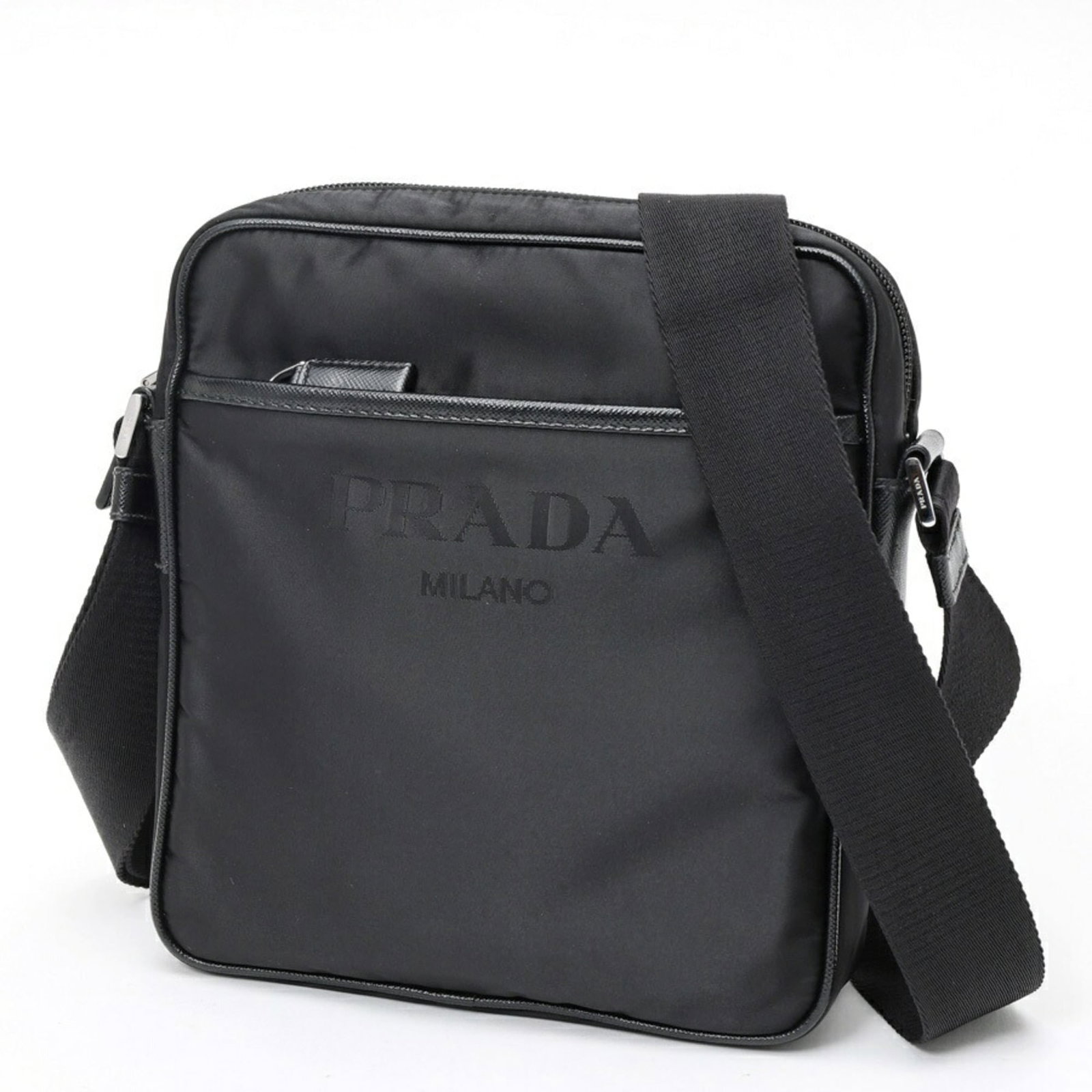 Shoulder Bag Nylon: Shoulder Bag Nylon The Prada Country shoulder bag features a sleek design made from durable nylon, with a classic black color that exudes timeless sophistication. Measuring 22cm x 20cm x 6cm, this ver