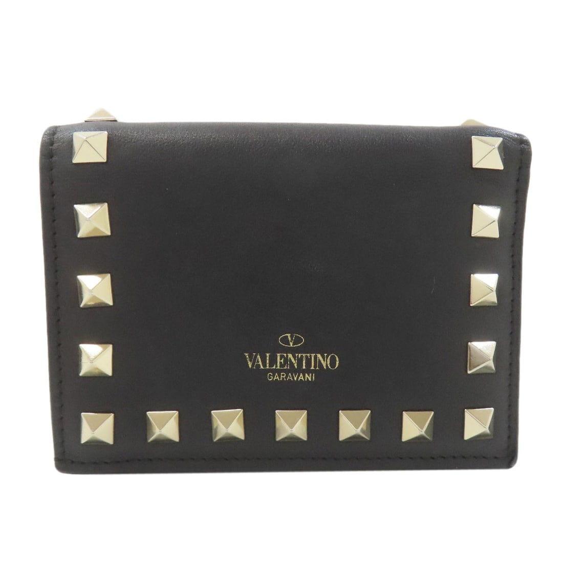 Valentino Rock Studs Bifold Wallet With Coin Pocket Leather: Valentino Rock Studs Bifold Wallet With Coin Pocket Leather Black leather bifold wallet with a coin pocket, featuring distinctive rock studs, adds a touch of sophistication to any outfit. The sleek