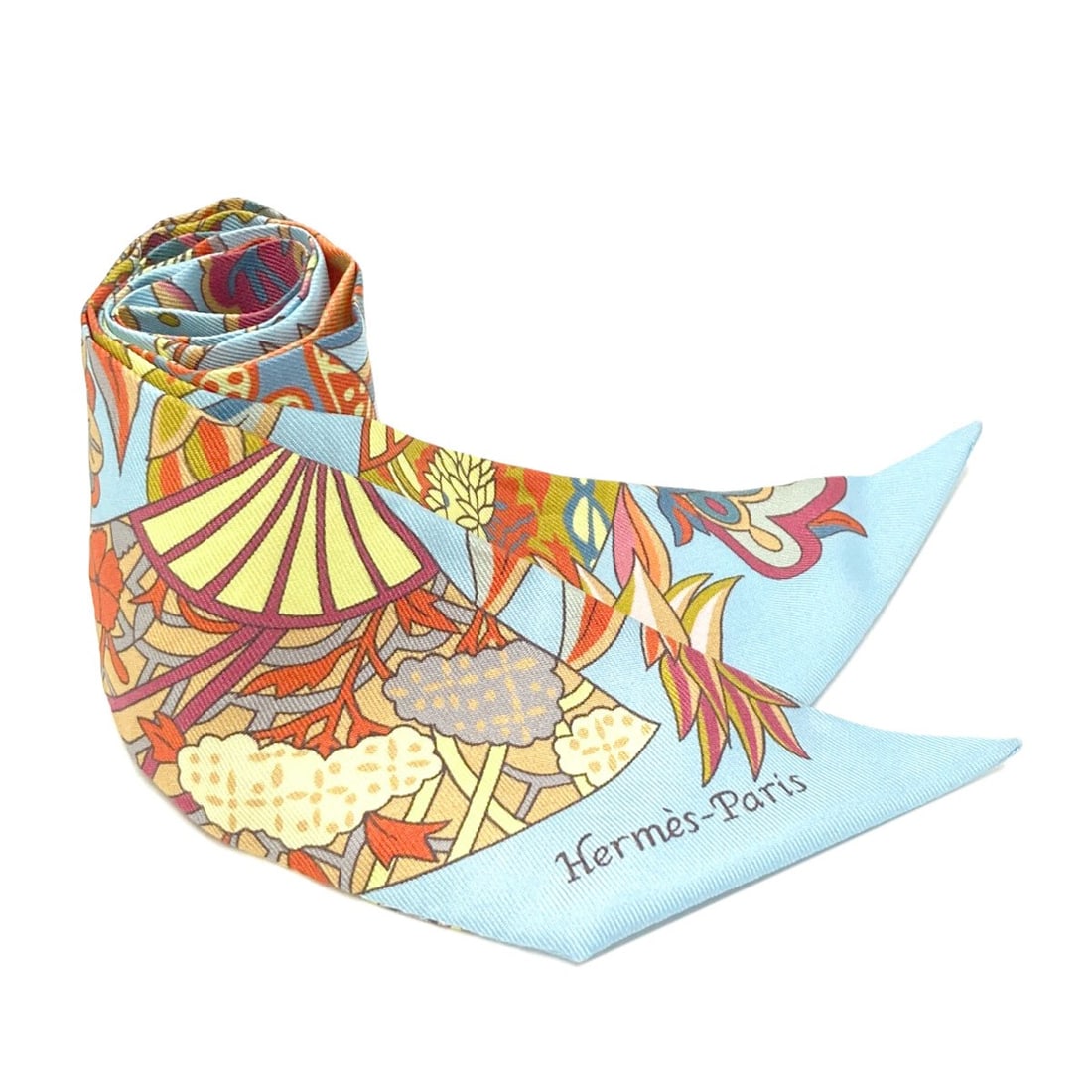 Hermes Silk Twilly Scarf: Hermes Silk Twilly Scarf Blue silk twilly scarf from the renowned brand HERMES, featuring a striking blue exterior. Made from high-quality silk, this scarf showcases the timeless elegance of the HERME