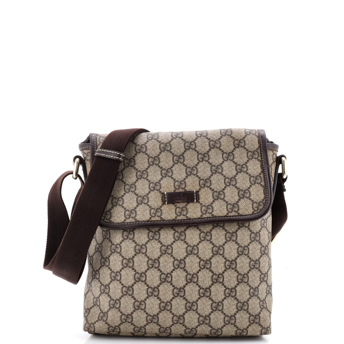 Gucci Flap Messenger Coated Canvas Small GG: Gucci Flap Messenger Coated Canvas Small GG Small Gucci Flap Messenger Coated Canvas Bag in Brown. This cross body bag features a canvas coated exterior with a gold GG buckle and a brown fabric interi