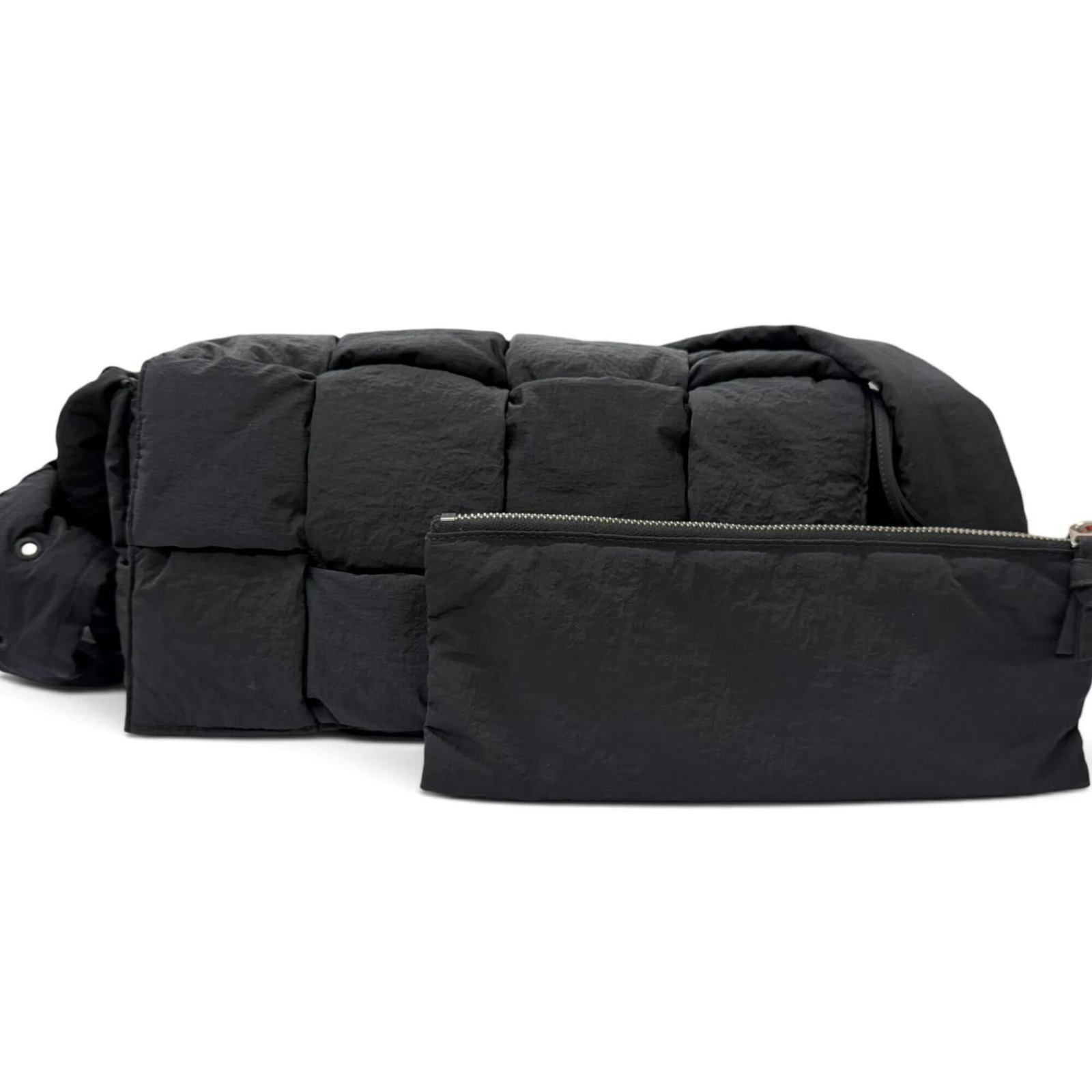 Nylon Sling Bag Veneta Shoulder Bag Bottega: Nylon Sling Bag Veneta Shoulder Bag Bottega Bottega Veneta's Nylon Sling Bag features a sleek and modern design, with a black nylon material and a signature Veneta logo. The bag's compact size and