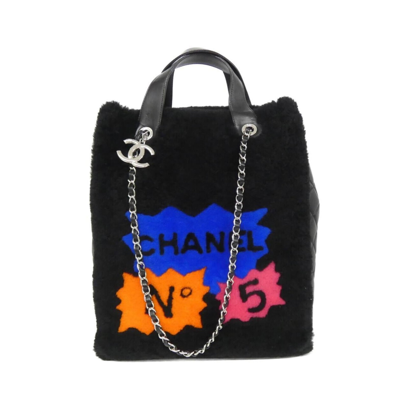 Handbag Leather from Chanel: Handbag Leather from Chanel This luxurious black lambskin handbag from Chanel features a sleek design and premium leather construction. The bag comes with a matching dust bag and guarantee card,