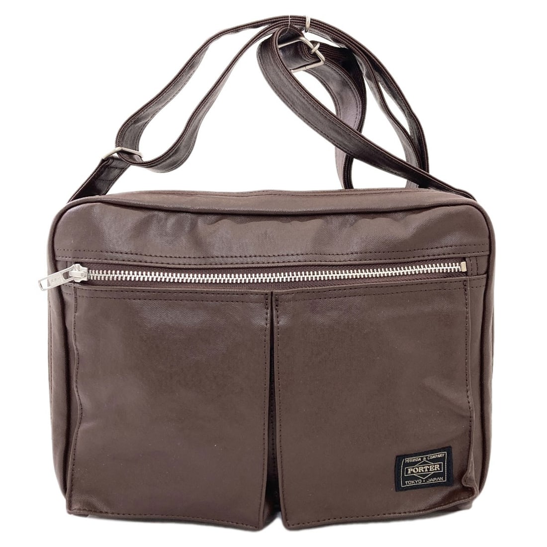 Shoulder Bag Canvas Coating Porter Logo: Shoulder Bag Canvas Coating Porter Logo Brown canvas coating porter logo shoulder bag. This shoulder bag features a brown exterior made of coating canvas, a durable and water-resistant material. The b