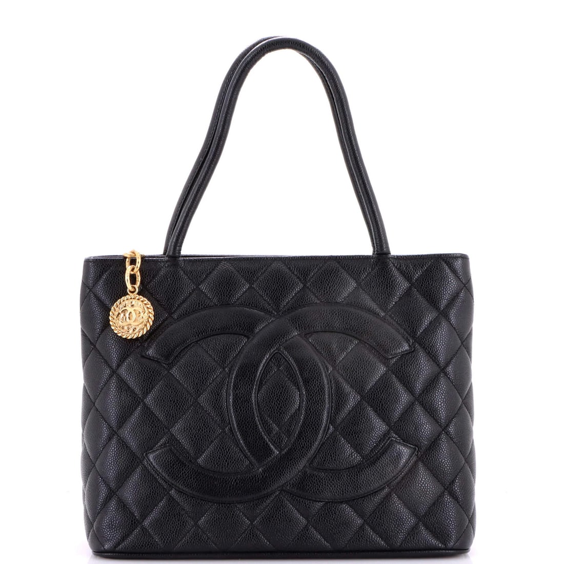 Caviar Quilted Tote Medallion Chanel: Caviar Quilted Tote Medallion Chanel Black quilted caviar leather Medallion Tote with gold hardware, featuring a classic Chanel design. This very good condition tote measures 7" handle drop, 9" height