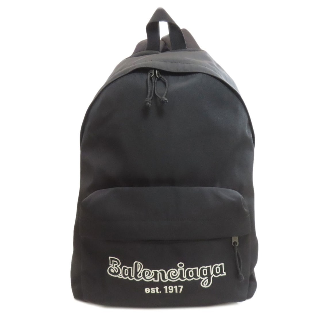 Balenciaga 503221 Logo Backpack ? Daypack Canvas: Balenciaga 503221 Logo Backpack ? Daypack Canvas Black canvas backpack with Balenciaga logo, designed as a daypack. The bag's exterior features a simple, bold logo that adds a touch of luxury to its