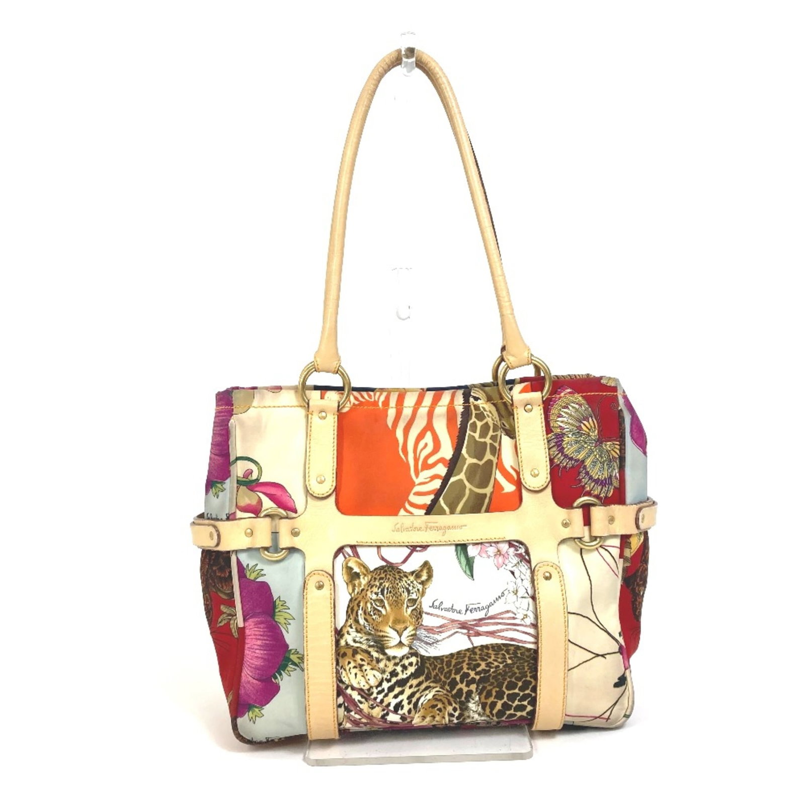 Salvatore Ferragamo Tote Cloth Bag: Salvatore Ferragamo Tote Cloth Bag Salvatore Ferragamo's iconic tote bag boasts a classic design with clean lines and a timeless silhouette. Made from high-quality cloth, this stylish tote measures