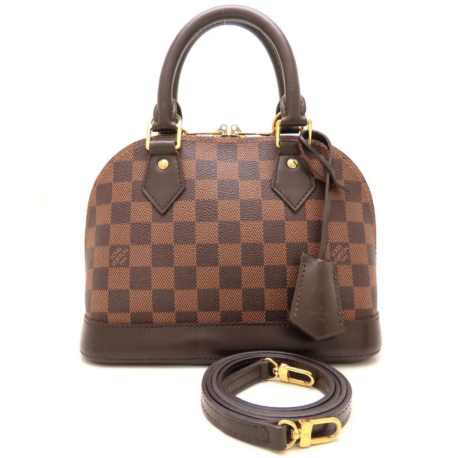 Damier Canvas Handbag Louis Vuitton: Damier Canvas Handbag Louis Vuitton Damier Canvas Handbag Louis Vuitton is made from Damier Canvas material and features Ebene color. It has a zipper closure and measures 17.5cm x 23.5cm x 11.5cm. Thi