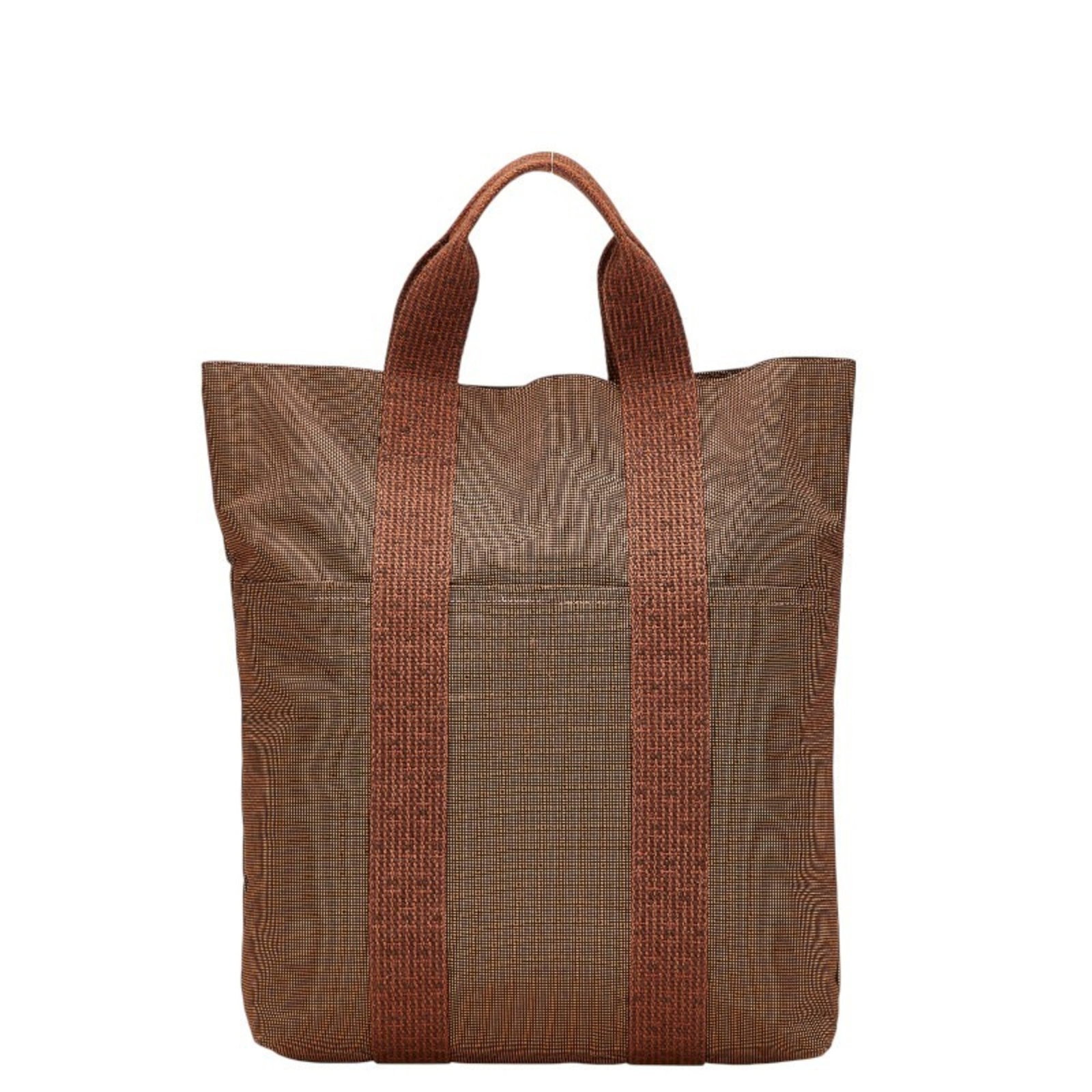Handbag Tote Bag Canvas Hermes: Handbag Tote Bag Canvas Hermes Canvas tote bag from the Hermes Line, featuring a classic brown color and sturdy canvas material. The bag boasts a practical design with a zipper closure and a spacious