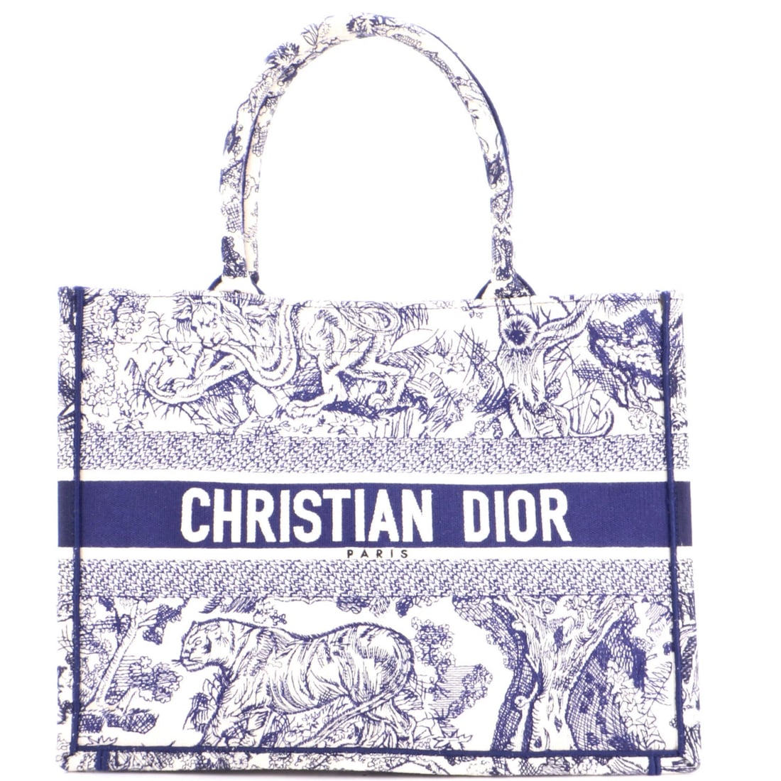 Canvas Embroidered Book Medium Christian Dior Tote: Canvas Embroidered Book Medium Christian Dior Tote Canvas Embroidered Book Medium Christian Dior Tote in Blue. This medium-sized tote features a canvas exterior with a striking embroidered design,