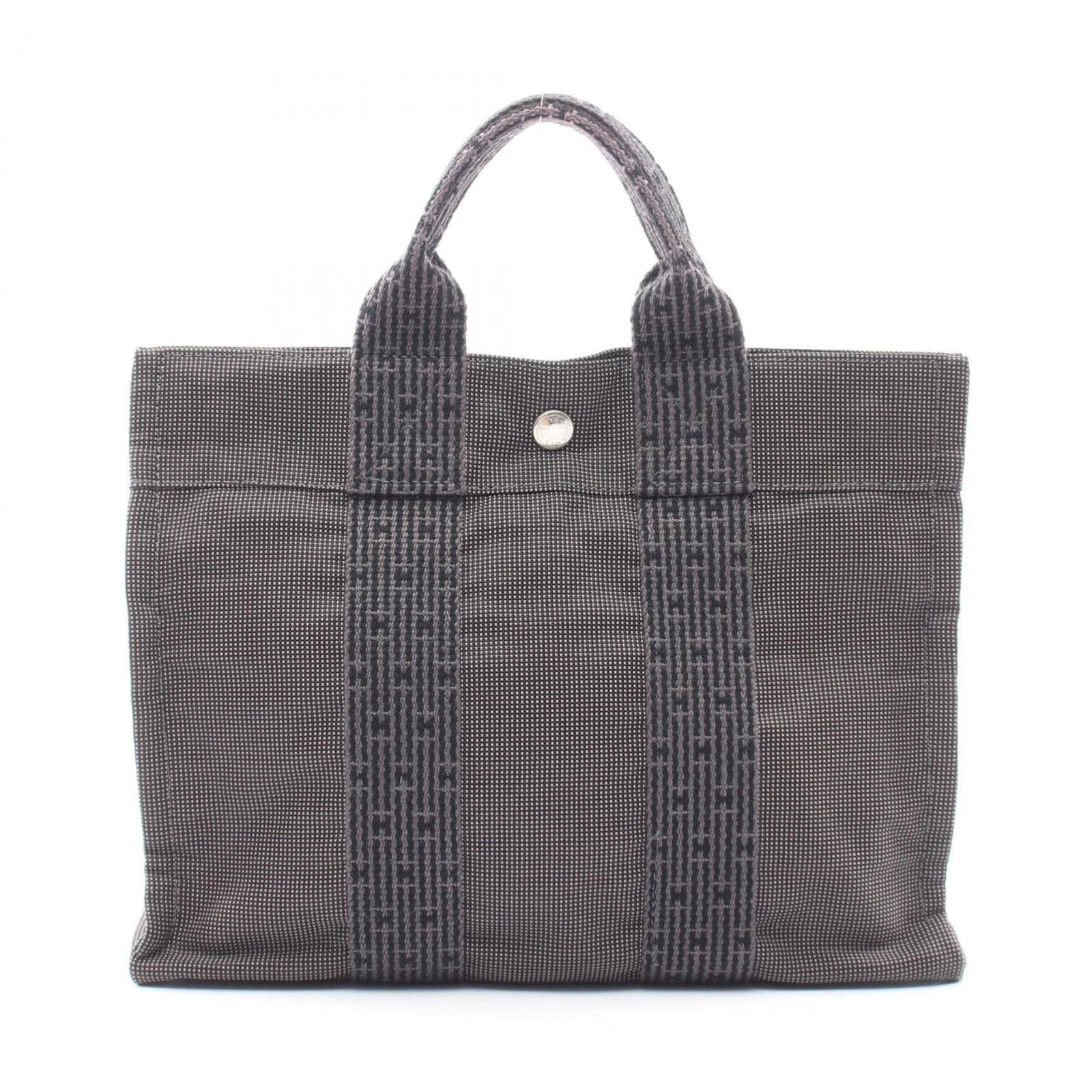 Nylon Canvas Handbag Hermes Tote: Nylon Canvas Handbag Hermes Tote Nylon canvas handbag with a timeless design, this gray tote bag measures 23cm x 30cm x 8cm and features a durable construction. The bag's gray color and classic style 