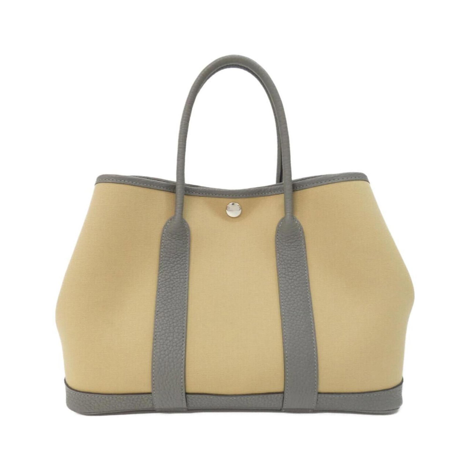 Hermes Handbag Leather Toile Negonda Officier: Hermes Handbag Leather Toile Negonda Officier Toile officier, Negonda leather, and classic design come together in this iconic Hermes Handbag, a timeless piece of luxury fashion. Measuring 21cm x
