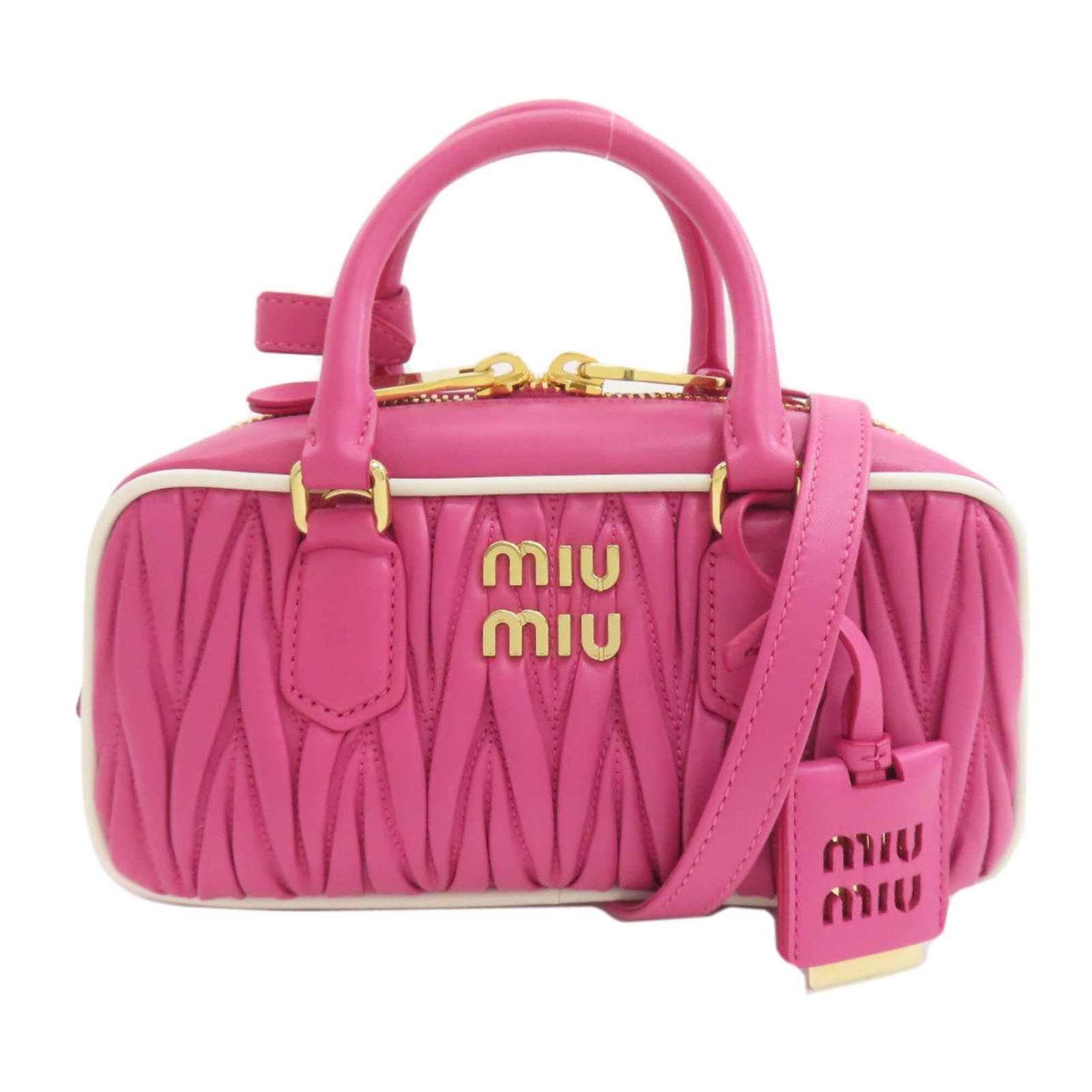 Handbag Miu Leather: Handbag Miu Leather The Miu Miu Handbag is crafted from high-quality Calfskin Leather, featuring a striking pink color. Measuring 12cm x 23cm x 8cm, this stylish accessory is designed to add a touch