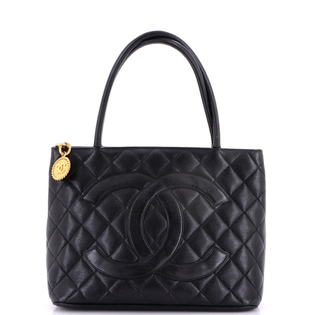 Caviar Quilted Tote Medallion Chanel: Caviar Quilted Tote Medallion Chanel Black quilted caviar leather Medallion Tote with silver hardware, featuring a classic Chanel design. This iconic tote boasts a timeless black exterior with minor w
