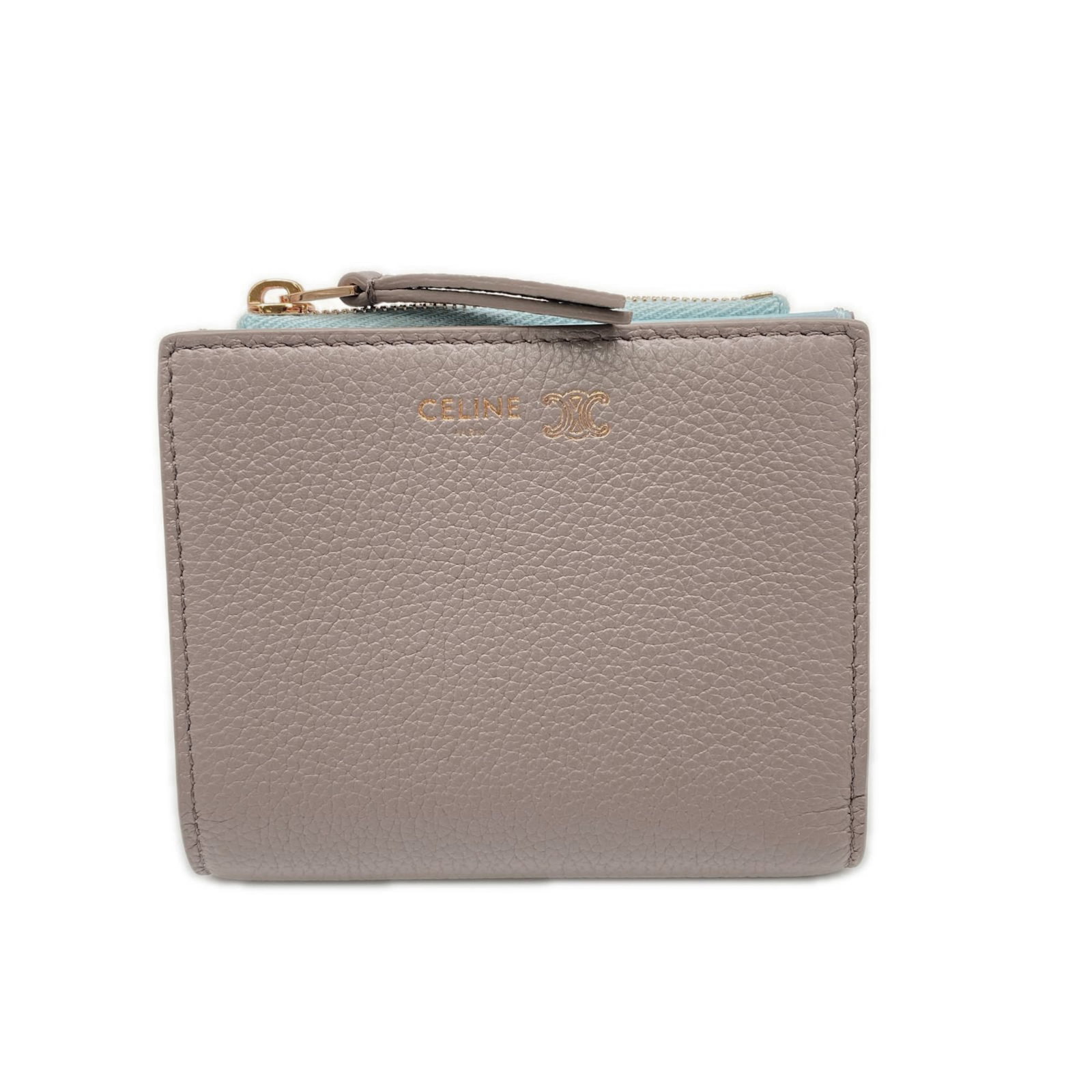 Celine Wallet (Bi-Fold) Leather: Celine Wallet (Bi-Fold) Leather Smooth calf leather wallet with a classic bi-fold design, available in blue and grayish tones. Made in Italy, this wallet features a sleek and sophisticated style.