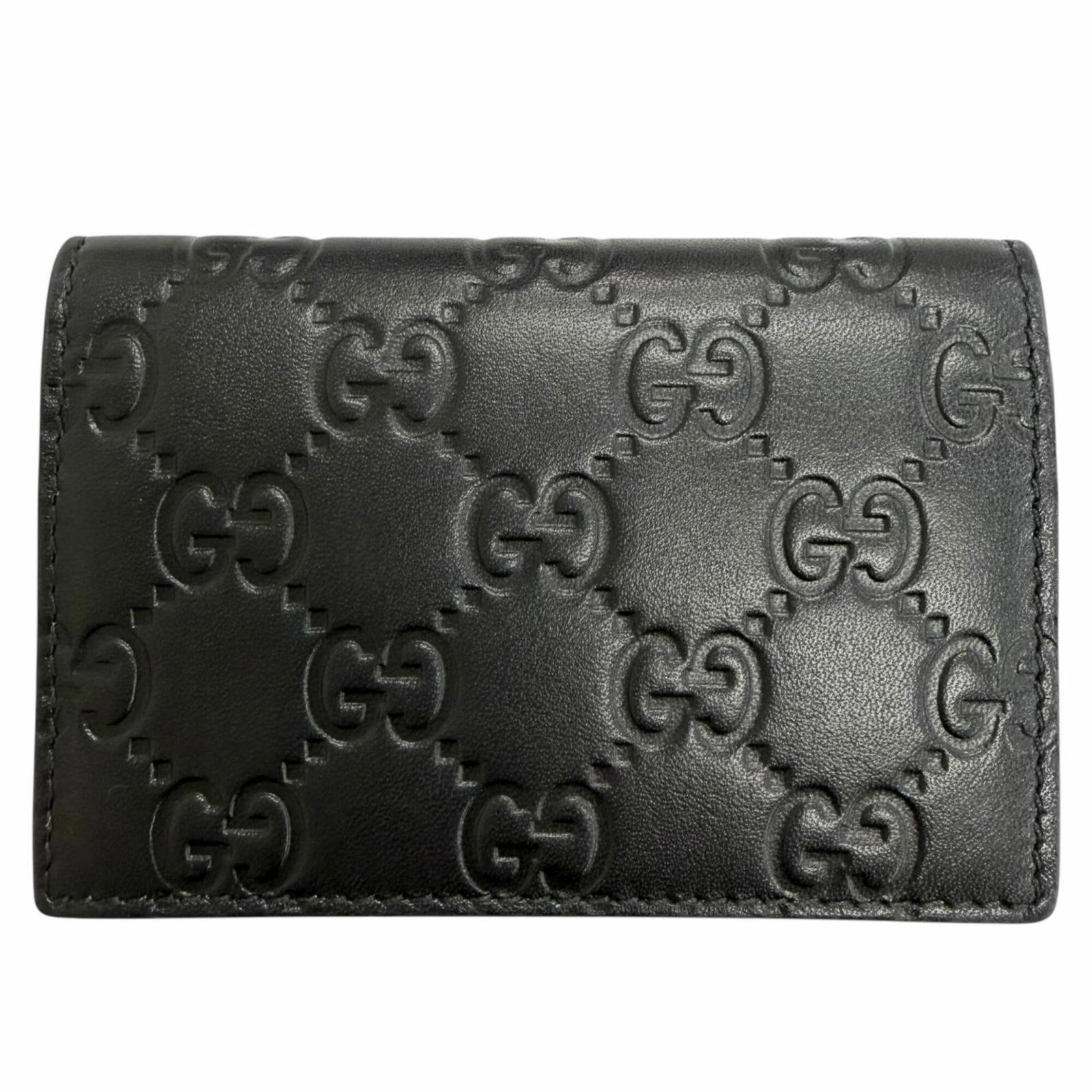 Case Card Leather Gucci: Case Card Leather Gucci This Gucci card case is made from high-quality black leather, measuring 7.5cm x 11cm. The Italian design showcases the brand's signature style, with a sleek and compact size